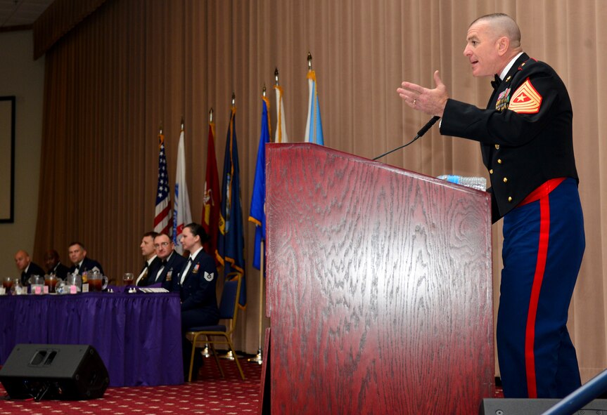 U.S. Marine Corps Sgt. Maj. Bryan Battaglia, senior enlisted advisor to the Chairman of the Joint Chiefs of Staff, speaks to attendees during the 2014 Joint Noncommissioned Officer Dining-In event hosted at Barksdale Air Force Base, La., Dec. 17, 2014. Battaglia spoke to NCOs and senior NCOs about the duties NCOs are charged with and the establishment of the NCO and petty officer corps, which was established 238 years ago. (U.S. Air Force photo/Airman 1st Class Mozer O. Da Cunha)