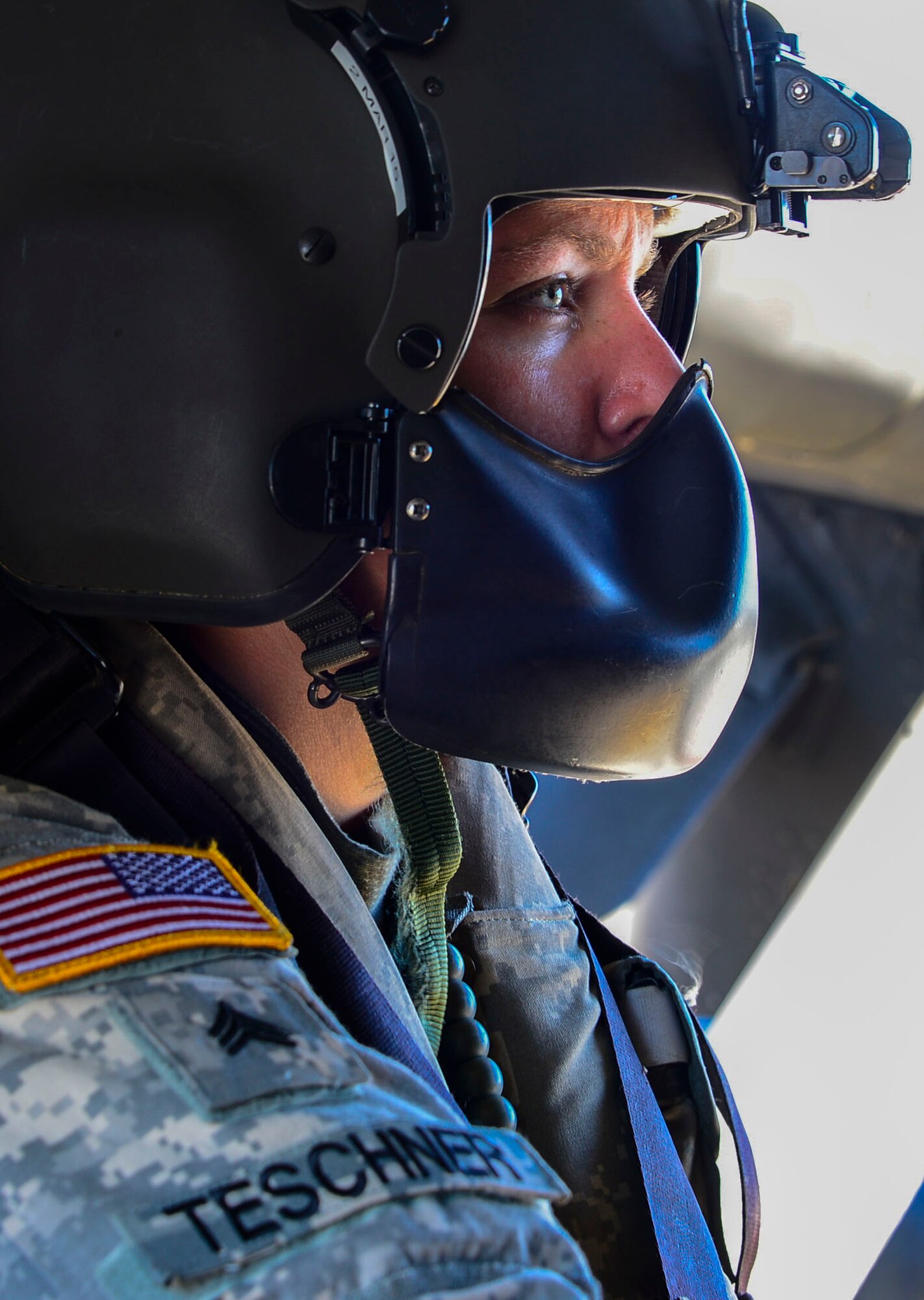 U.S. Army Sgt. Kelly Teschner, 1-228th Aviation Battalion crew chief, prepares for takeoff at Soto Cano Air Base, Honduras, Dec. 18, 2014.  The 1-228th AVN BN spent the afternoon practicing overwater hoist training.  The overwater hoist training was held to ensure members of Joint Task Force-Bravo are planning and preparing for crisis and contingency response as part of U.S. Southern Command’s mission. Contingency planning prepares the command for various scenarios that pose the greatest probability of challenging our regional partners or threatening our national interests.  (U.S. Air Force photo/Tech. Sgt. Heather Redman)