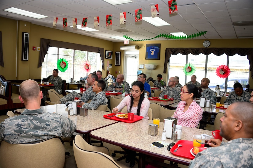 Members of Joint Task Force-Bravo listen to U.S. Army Col. Michael Lembke, U.S. Southern Command chaplain’s message during the December Prayer Breakfast at the Dining Facility, on Soto Cano Air Base, Honduras, Dec. 18, 2014.  (U.S. Air Force photo/Tech. Sgt. Heather Redman)