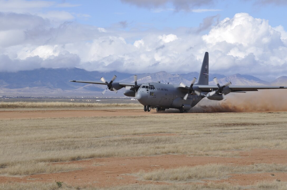A C-130 from the 94th Airlift Wing lands on a dirt runway in Arizona on Dec. 17, 2014. Pilots from the 700th Airlift Squadron were performing landing training on dirt runways in preparation for an upcoming deployment. (U.S. Air Force Photo by Senior Airman Miles Wilson)