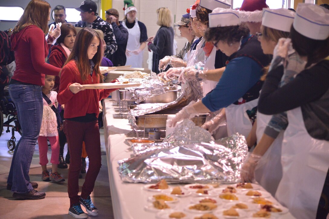 Lunch was served to about 2,000 people from the local communities at the Operation Holiday Cheer event Dec. 17. In addition, more than 800 toys were given away to children. Operation Holiday Cheer is sponsored by the Kirtland Fire Department and is one of the base's biggest charity events of the year. (Photo by Todd Berenger)