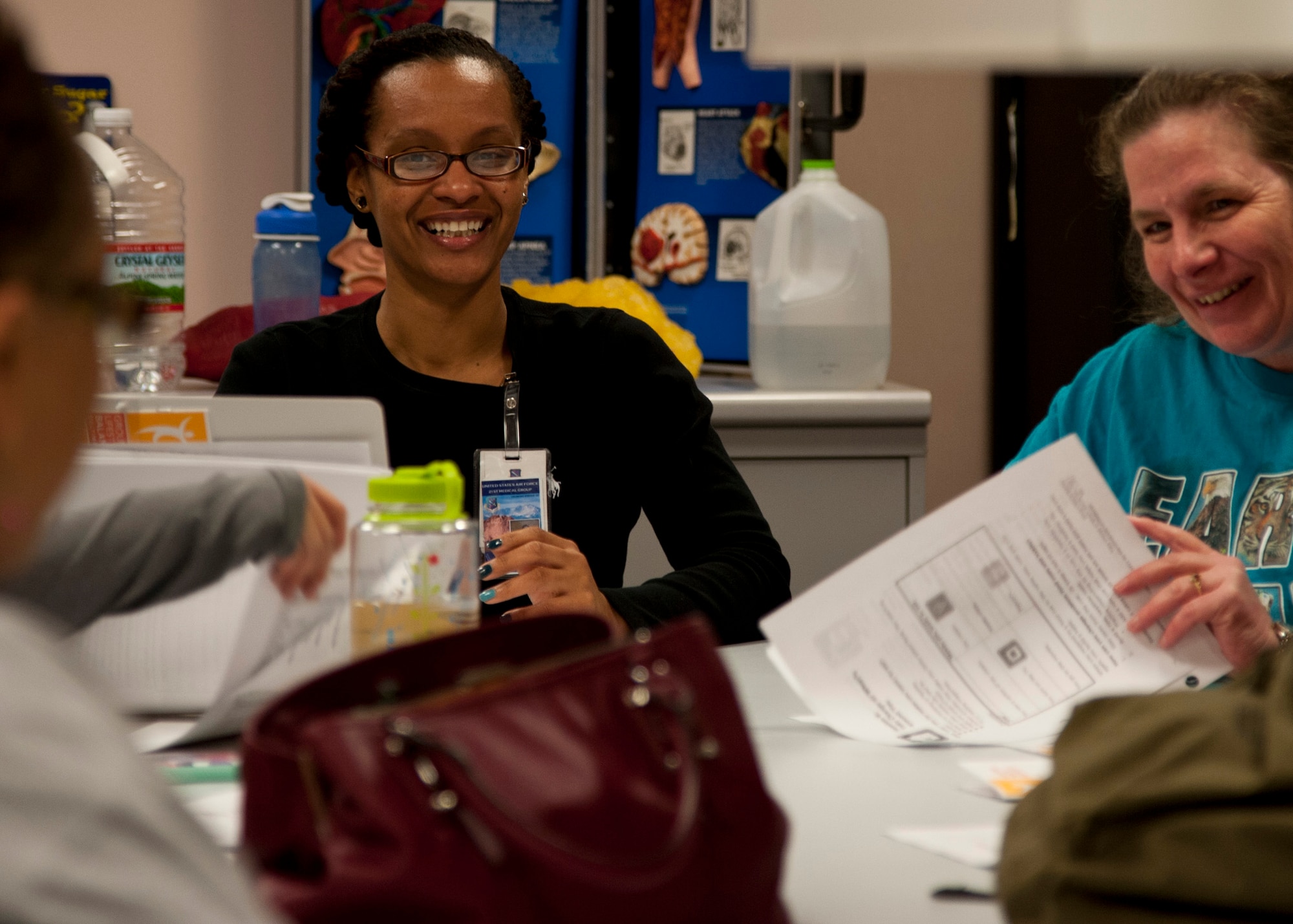 PETERSON AIR FORCE BASE, Colo. - Dana Johnson, Health and Wellness Center health educator, instructs an education class on healthier snack options during the 12-week weight management program, Dec. 15, 2014. During the program, which is geared towards adults, participants learn ways to ease into a healthy lifestyle, lose body fat and maintain everything for a long period of time. (Air Force photo by Senior Airman Tiffany DeNault)