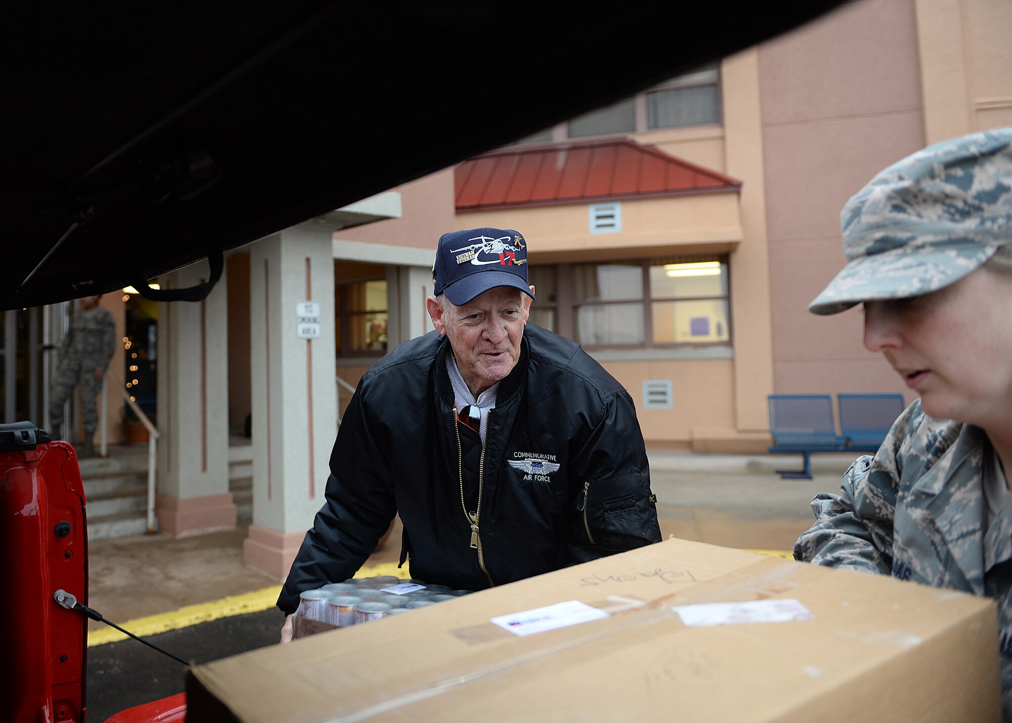 CLINTON, Okla. – Retired U.S. Air Force Chief Master Sgt. Stephen Francis unloads supplies from the back of a truck during a volunteer trip to the Oklahoma Veteran’s Center, Dec. 17, 2014. Boxes full of sanitary items and drinks were stocked directly into the center’s pantry to be used at a later date, and 100 packages and cards were presented to the veterans. Francis is a member of the Air Force Sergeant’s Association chapter 988 in Altus. (U.S. Air Force photo by Airman 1st Class Megan E. Acs/Released)