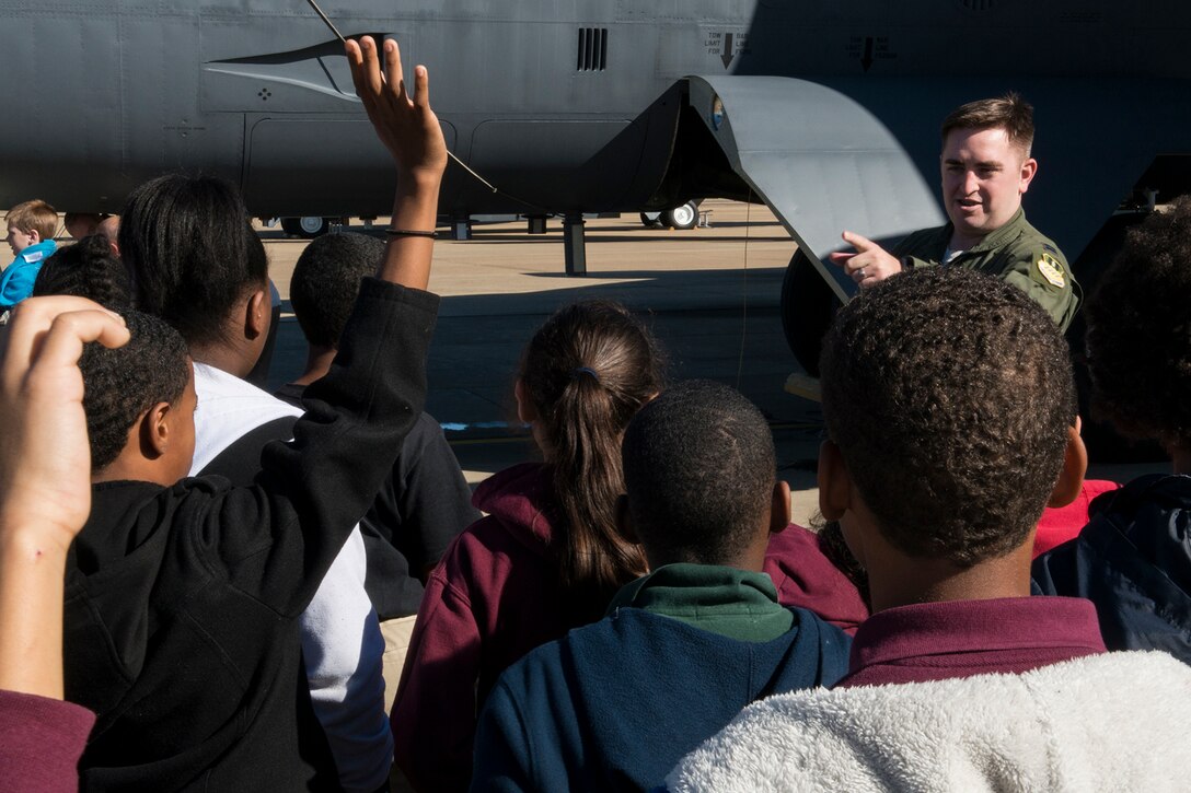 U.S. Air Force Capt. Doug Lewandowski answers questions from a group of STARBASE students during a tour of a B-52H Stratofortress, Dec. 9, 2014, Barksdale Air Force Base, La. The STARBASE program is a 25-hour hands on/minds on environment that actively engages students in exploration of Science, Technology, Engineering and Mathematics to excite their interest, develop a solid concept base and encourage pursuit of these four fields for future careers. (U.S. Air Force photo by Master Sgt. Greg Steele/Released)