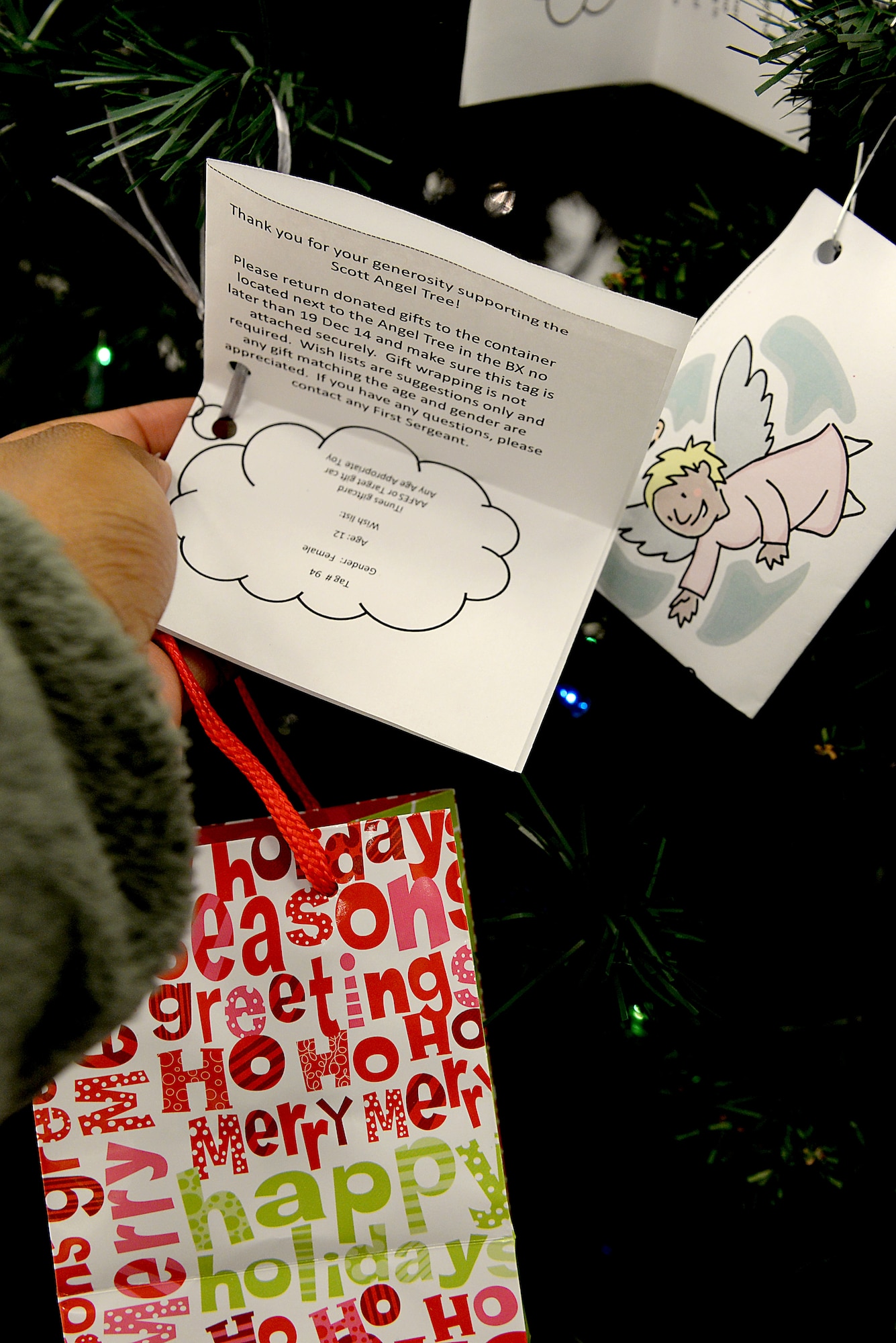 To assist families in need, Scott’s First Sergeants group sponsored the Annual Angel Tree program. The program helps gather gifts for families associated with Scott Air Force Base, Ill. The tree is located at the Base Exchange now through Christmas Eve, but the first sergeants hope to deliver all gifts before then. (U.S. Air Force photo/ Airman 1st Class Kiana Brothers)