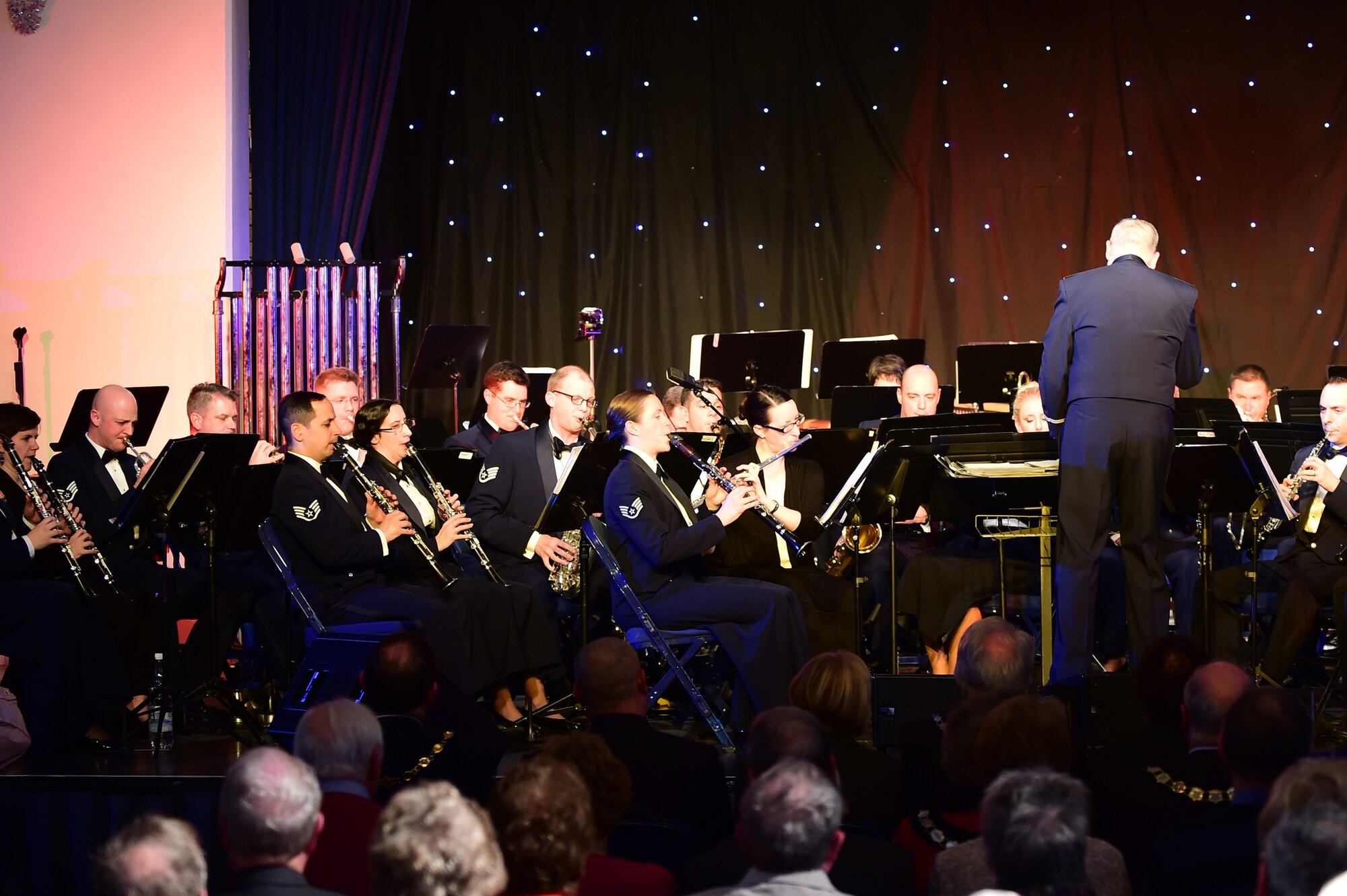 The U.S. Air Forces in Europe Concert band of nearly 40 members plays a holiday celebration at Burgess Hall in St. Ives, Cambridgeshire, England, Dec. 18, 2014. The band played songs ranging from “O Holy Night” to “Jingle Bells” as a way to thank the community members who support USAFE installations. (U.S. Air Force photo by Tech. Sgt. Chrissy Best)