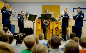 Members of the United States Air Force Band play for children at the Child Development Center on Joint Base Andrews, Dec.19, 2014. The band played a variety of holiday favorites at all three child development centers and the Imagine Andrews Charter School. (U.S. Air Force photo by Senior Airman Mariah Haddenham)