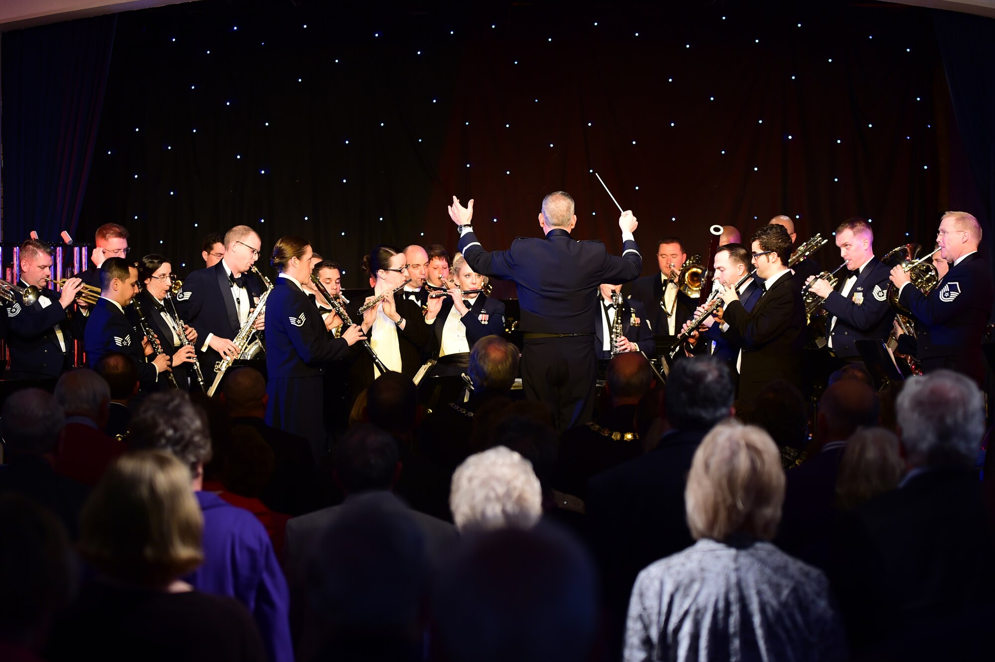 The U.S. Air Forces in Europe Concert band of nearly 40 members plays a holiday celebration at Burgess Hall in St. Ives, Cambridgeshire, England, Dec. 18, 2014. The band played songs ranging from “O Holy Night” to “Jingle Bells” as a way to say thank you to the community members who support USAFE installations.  (U.S. Air Force photo by Tech. Sgt. Chrissy Best)