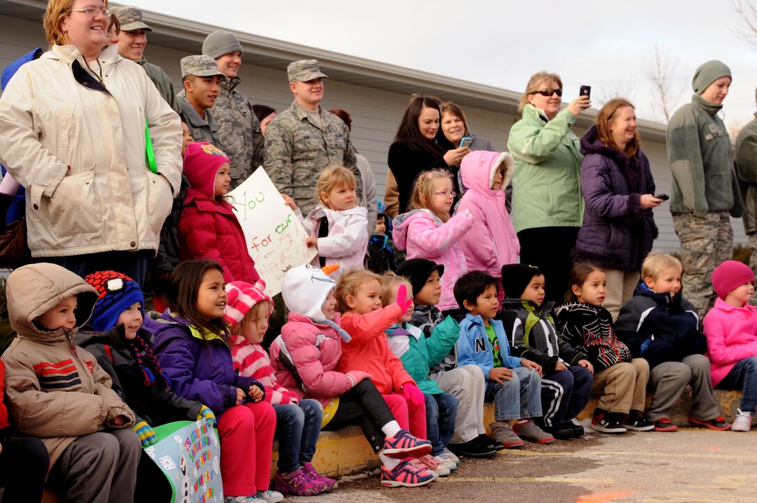 Children and teachers wait for Santa’s arrival at the Youth & Family Services Child Development Center in Rapid City, S.D., Dec. 16, 2014. (U.S. Air Force photo by Senior Airman Hailey R. Staker/Released)