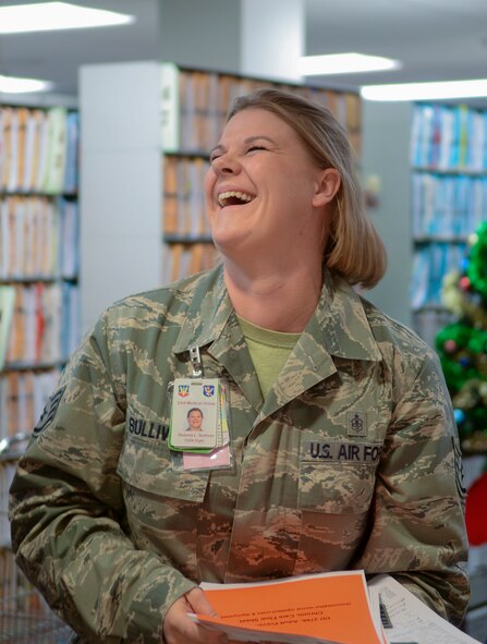 U.S. Air Force Tech Sgt. Shanna Sullivan, 23d Medical Group NCO in charge of outpatient records, laughs as she receives a Stripes for Exceptional Performers (STEP) promotion as a Staff Sergeant from Col. Chad Franks, 23d Wing commander, on Dec. 18, 2014 at Moody Air Force Base, Ga. Sullivan was genuinely surprised, not knowing she had been nominated for this promotion. (U.S. Air Force photo by Airman 1st Class Kathleen Bryant/Released)