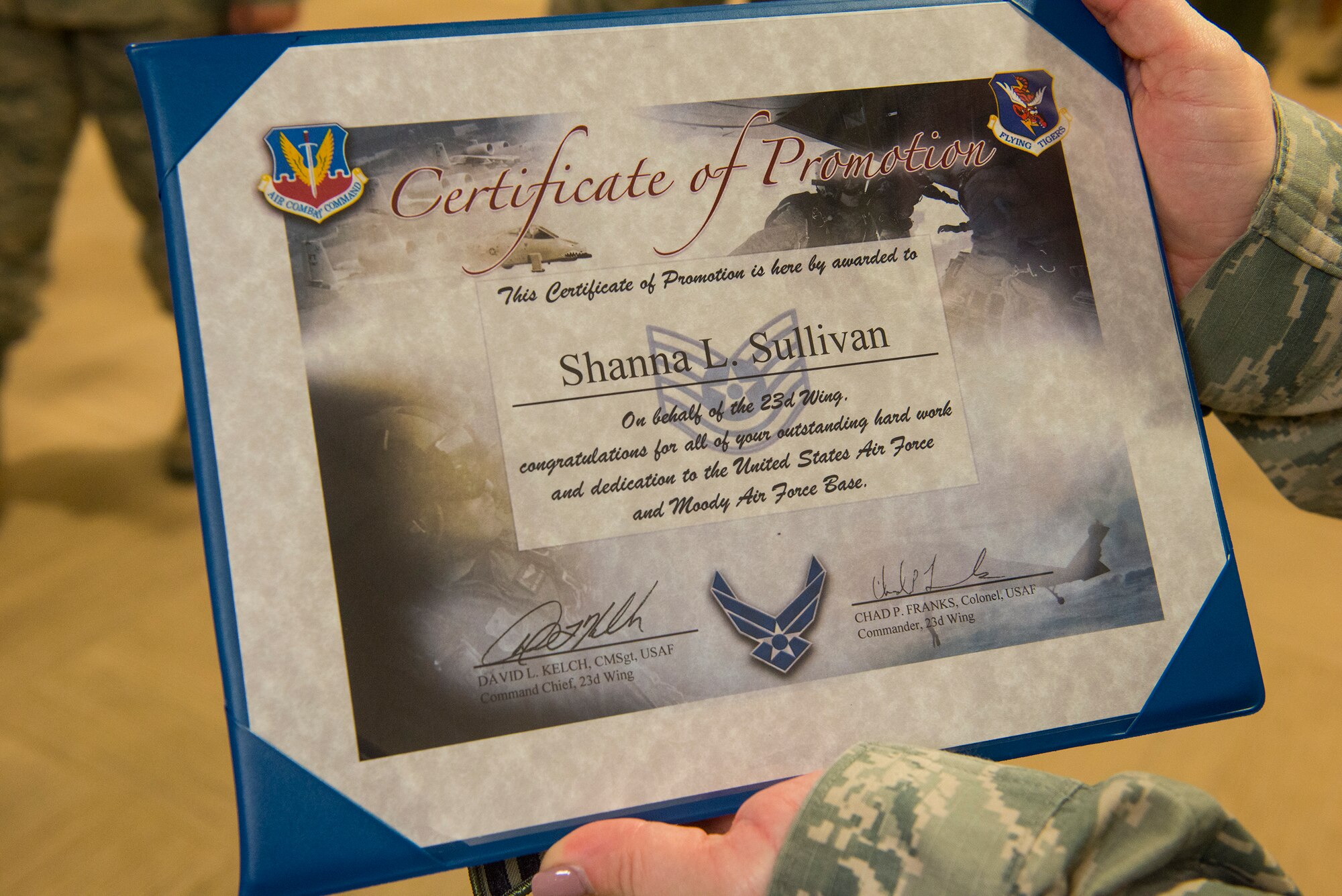 U.S. Air Force Tech. Sgt. Shanna Sullivan, 23d Medical Group NCO in charge of outpatient records, holds her certificate after being promoted Dec. 18, 2014, at Moody Air Force Base, Ga. Sullivan was promoted under the Air Force’s Stripes for Exceptional Performers program. (U.S. Air Force Airman 1st Class Ceaira Tinsley/Released)
