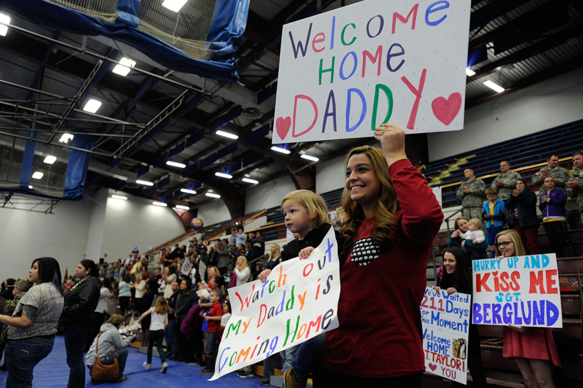 Friends and families wait for the return of their loved ones at Joint Base Elmendorf-Richardson, Alaska, Dec. 14, 2014. About 70 Soldiers returned from the final U.S. Army Alaska unit serving in Afghanistan. (U.S. Air Force photo/Staff Sgt. Robert Barnett)