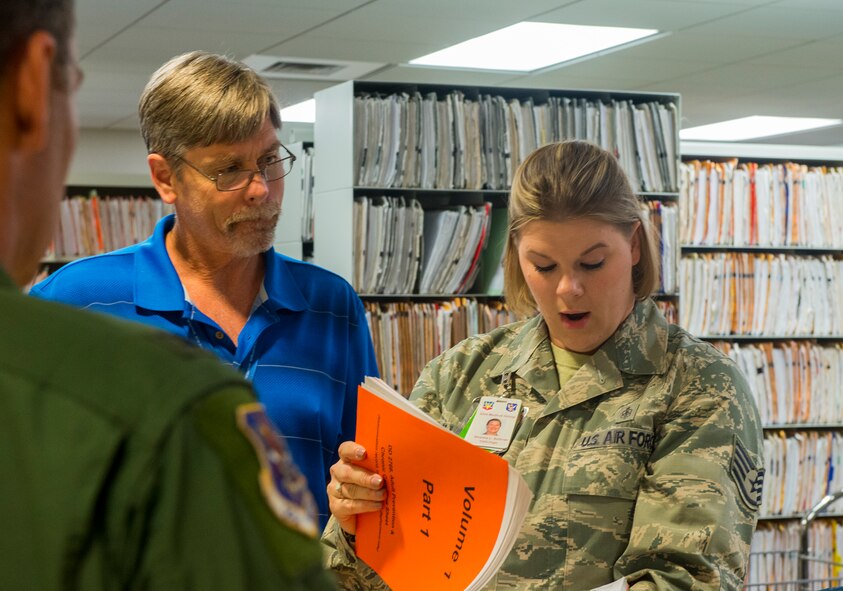 U.S. Air Force Tech. Sgt. Shanna Sullivan, 23d Medical Group NCO in charge of outpatient records, looks through a records folder Dec. 18, 2014, at Moody Air Force Base, Ga. Col. Chad Franks, 23d Wing commander, placed technical sergeant stripes inside of his son’s records folder and used it to announce to Sullivan that she was being promoted under the Stripes for Exceptional Performers program. (U.S. Air Force Airman 1st Class Ceaira Tinsley/Released)