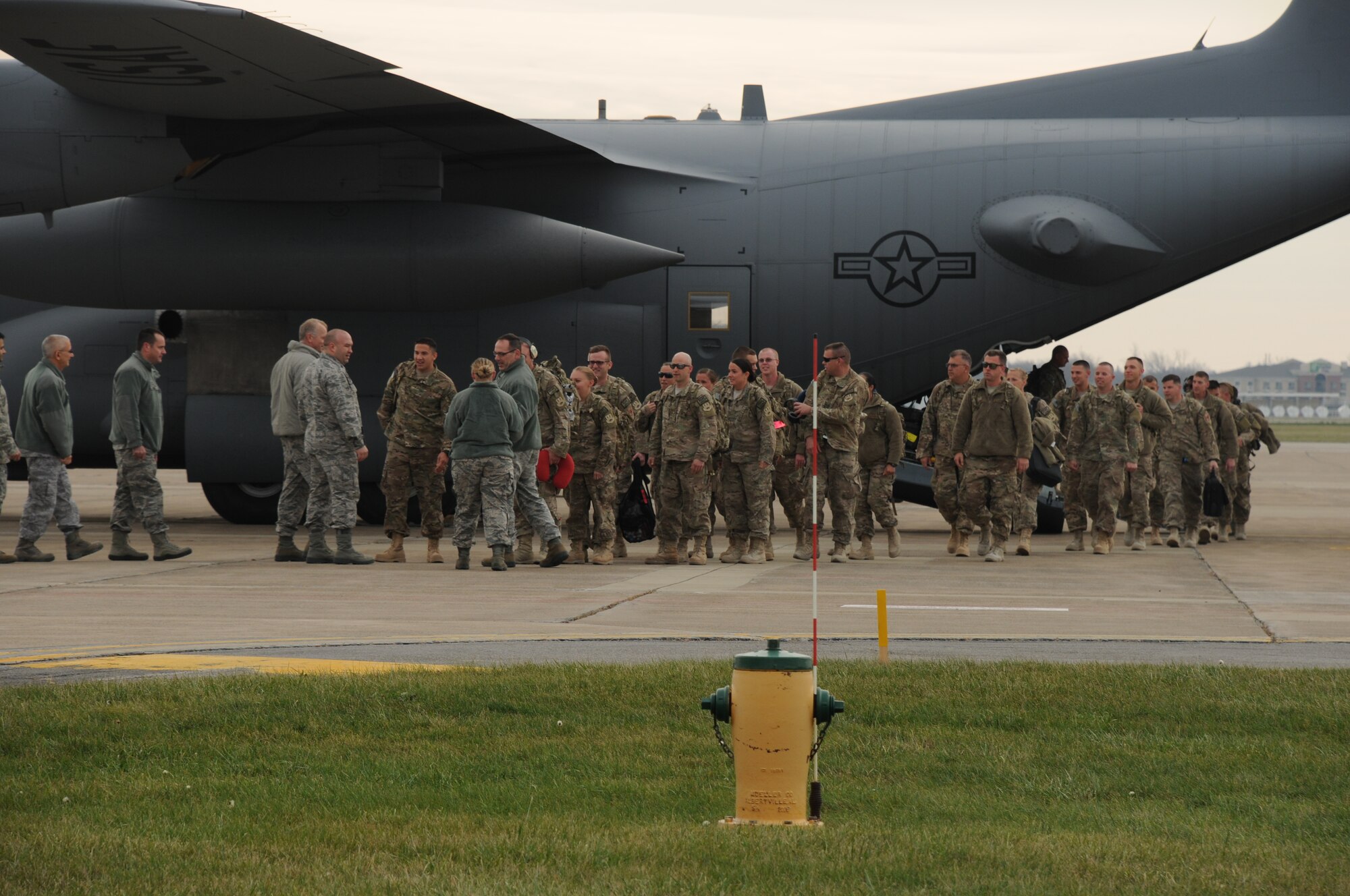 Members of the 30th Aerial Port Squadron return home Dec. 6, 2014 at Niagara Falls Air Reserve Station, N.Y. 35 personnel from the base were sent to a deployment in Afghanistan. (U.S. Air Force Photo by Staff Sgt. Matthew Burke)