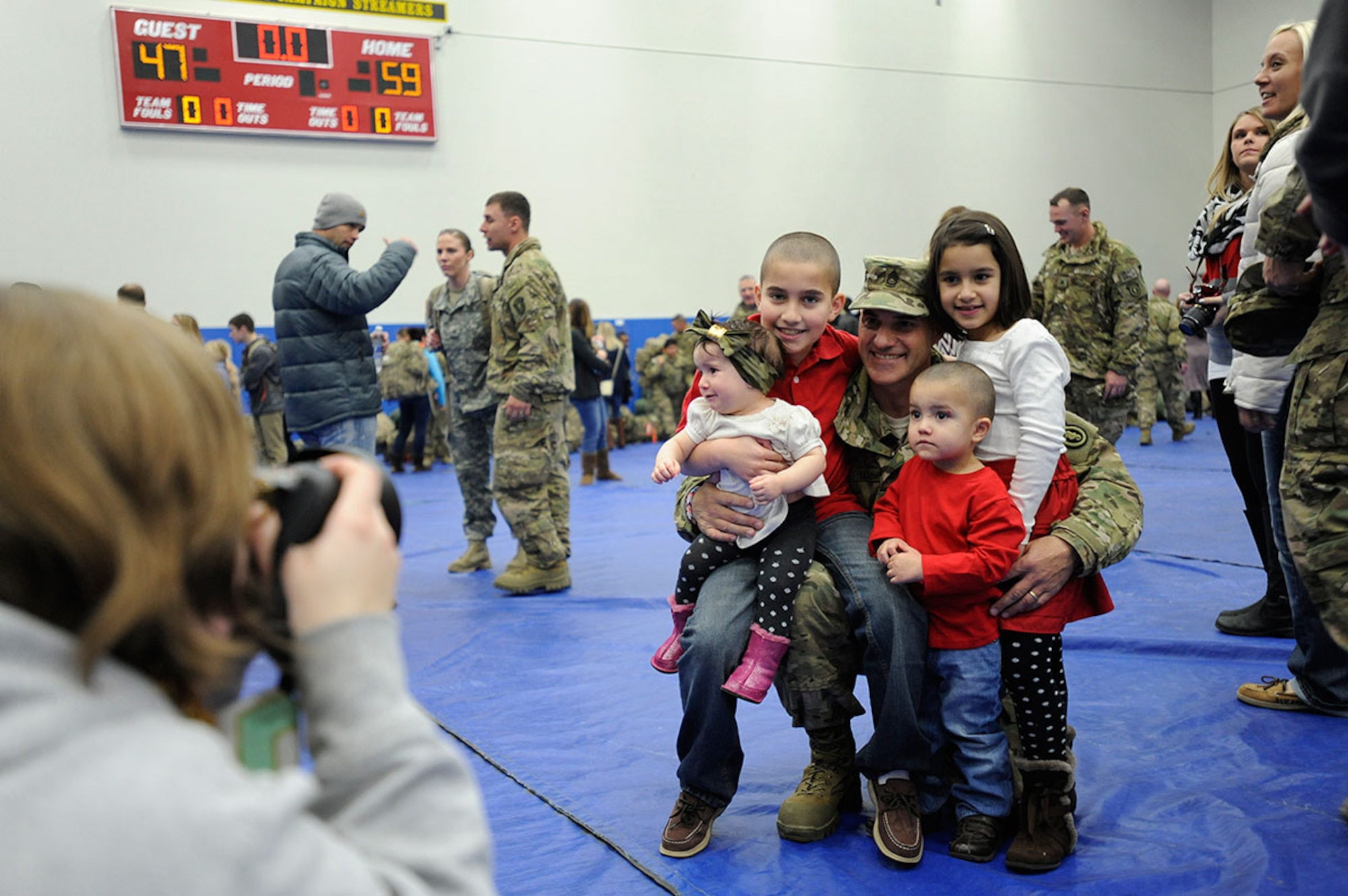 Friends and families celebrated the return of their loved ones at Joint Base Elmendorf-Richardson, Alaska, Dec. 14, 2014. About 70 Soldiers returned from the final U.S. Army Alaska unit serving in Afghanistan. (U.S. Air Force photo/Staff Sgt. Robert Barnett)