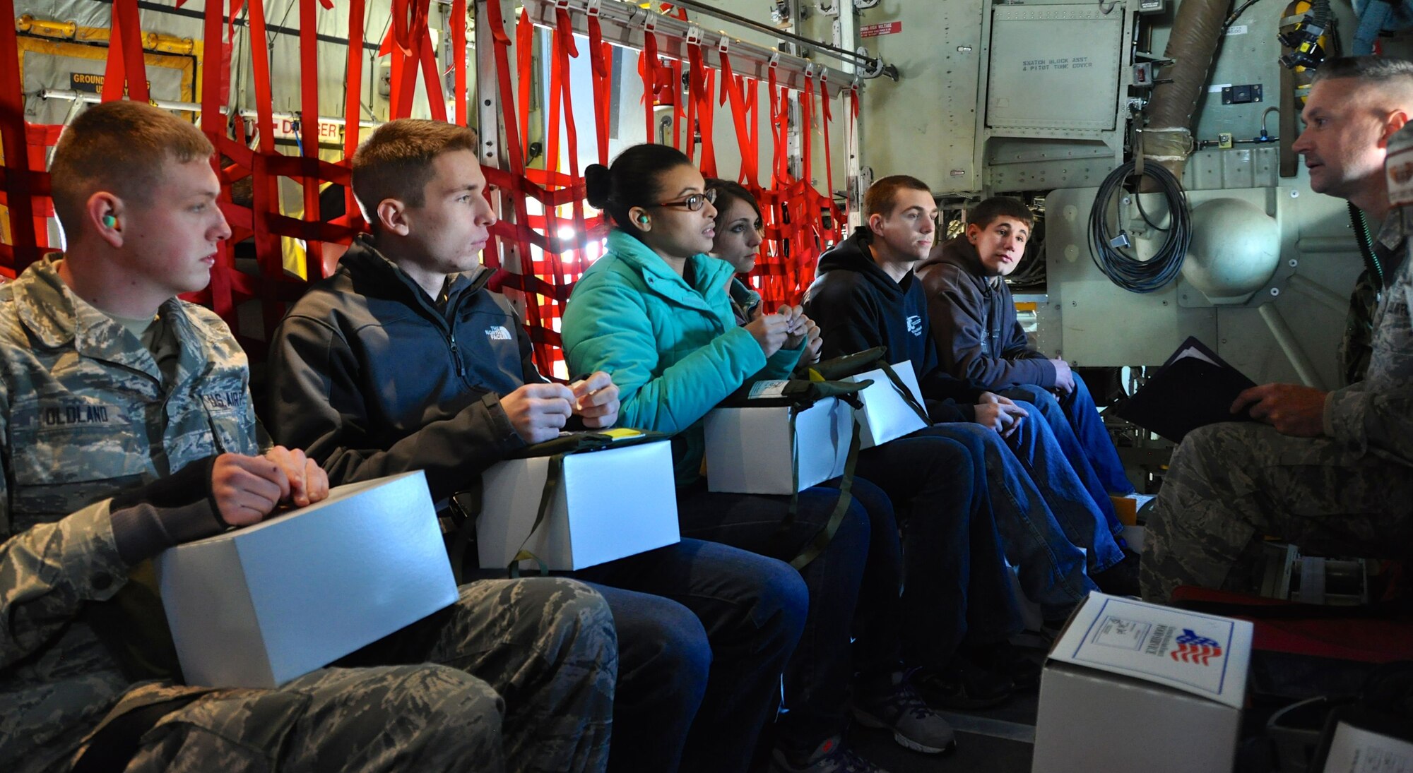 Trainees get some last words and instructions before takeoff from Master Sgt. Val R. Armel, leader of the Development and Training Flight, at Pittsburgh International Airport Air Reserve Station, Pa., Dec. 7, 2014. The goal of the Development and Training Flight is to prepare trainees for the rigors of United States Air Force Basic Military Training. (U.S. Air Force photo by Senior Airman Joseph E. Bridge)