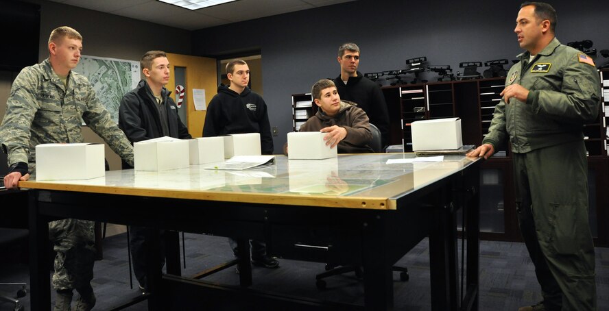 Trainees of the 911th Airlift Wing’s Development and Training Flight get a pre-flight brief before taking part in their first flight on military aircraft, Dec. 7, 2014, at Pittsburgh International Airport Air Reserve Station, Pa. The flight had two major purposes; the first was to have aero-medical staff of the 911th train, equip and develop their skills while in flight and the second being to familiarize the trainees with different aspects of a career in the Air Force. (U.S. Air Force photo by Senior Airman Joseph E. Bridge)