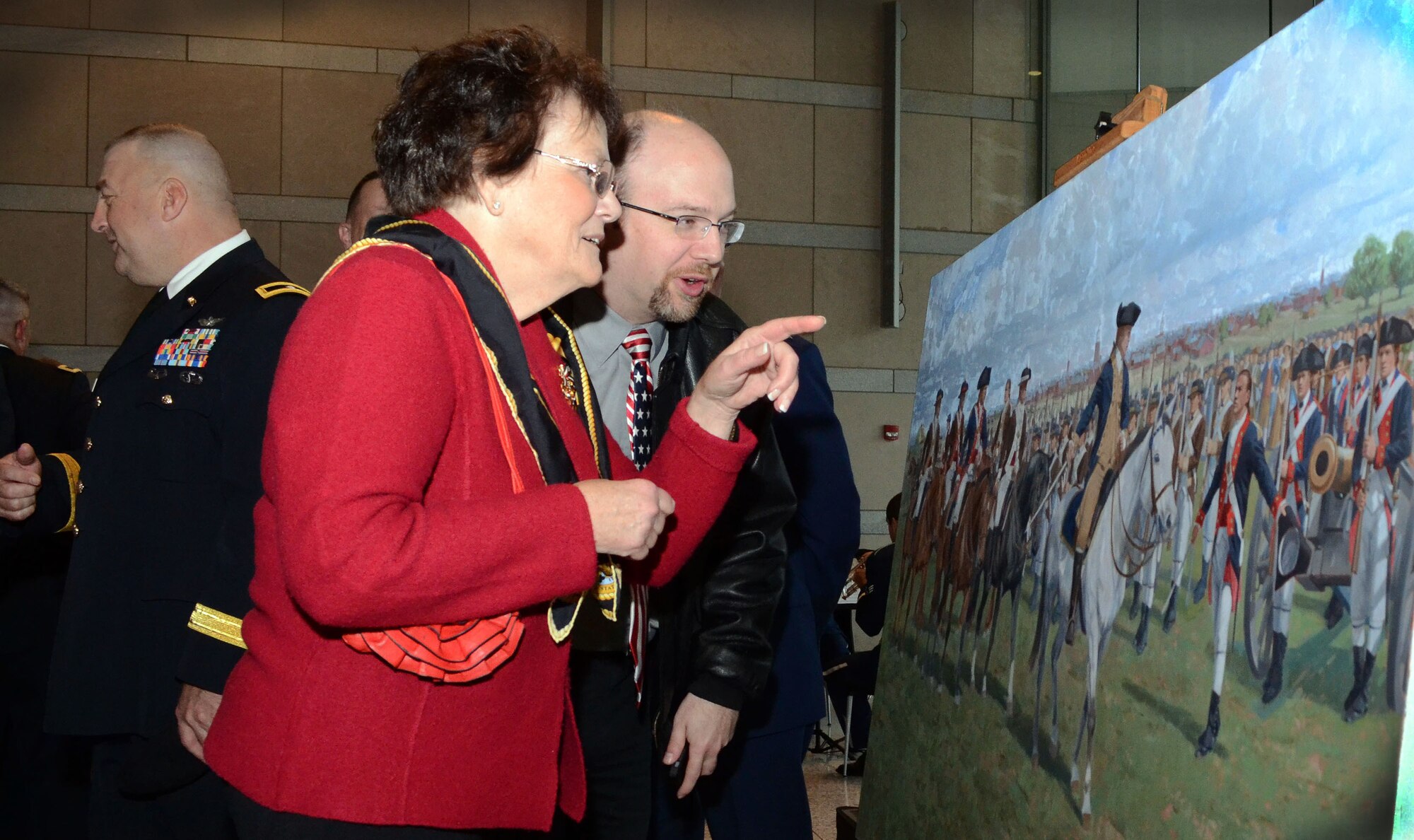 Military members and civilians take an opportunity to look at the painting, “Washington’s Review," by artist Larry Selman, during its unveiling Dec. 6, 2014, at the National Constitution Center”, Philadelphia, Pa. The painting is slated for display at the Pennsylvania National Guard’s Joint Force Headquarters at Fort Indiantown Gap, Pa. (U.S. Air National Guard photo by Master Sgt. Christopher Botzum/Released)