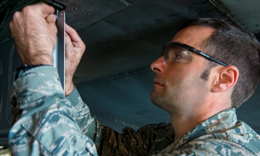 U.S. Air Force Tech. Sgt. Curtis Lasher, 23d Equipment Maintenance Squadron crew chief, tightens a screw during an isochronal inspection Dec. 10, 2014, at Moody Air Force Base, Ga. ISO inspections are timed inspections where Airmen take the aircraft apart, inspect, fix and reassemble it. (U.S. Air Force photo by Airman 1st Class Ceaira Tinsley)
