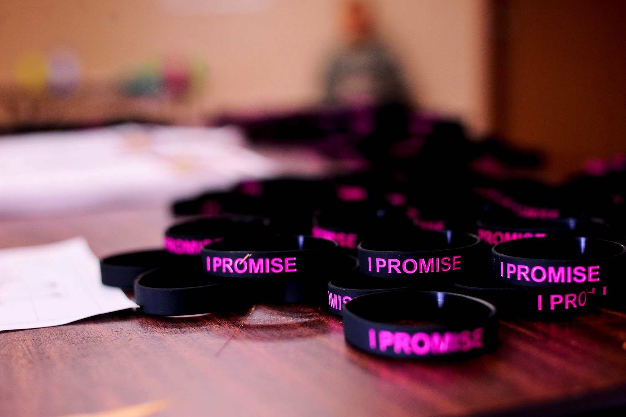 “I promise not to drive under the influence” bracelets lay on a table at MacDill Air Force Base, Fla. base theater Dec. 18, 2014. The bracelet serves as a reminder to never drink and drive, have a plan. (U.S. Air Force photo by Senior Airman Melanie Bulow-Gonterman/Released)  