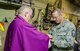 Chaplain (Lt. Col.) Patrick Cooney celebrates his final Mass as Catholic chaplain for the 123rd Airlift Wing at the Kentucky Air National Guard Base in Louisville, Ky., Dec. 7, 2014. Cooney retired from military service the same day, concluding a career of more than 30 years in the active-duty Air Force and Air National Guard. (U.S. Air National Guard photo by Senior Airman Joshua Horton)