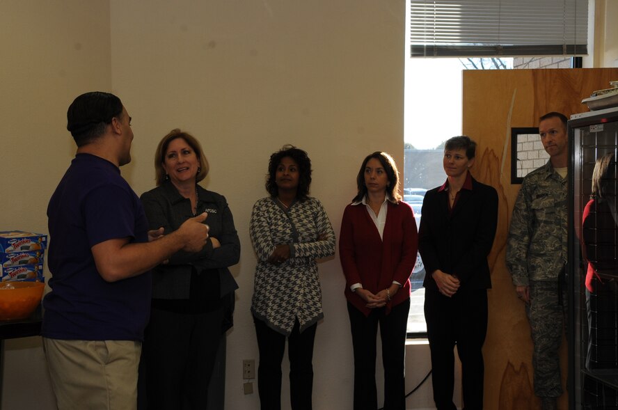 Patrick Catanese, left, Protestant Parish coordinator and director of the River’s Edge, briefs Air Force Global Strike Command spouses about the River’s Edge and changes need to be made in the future on Barksdale Air Force Base, La. Dec. 16, 2014. The River’s Edge program offers a wide range of activities such as video game tournaments, a music room with various instruments, food and drinks, free wireless Internet and more to single Airmen on Barksdale. (U.S. Air Force photo/Senior Airman Kristin High)