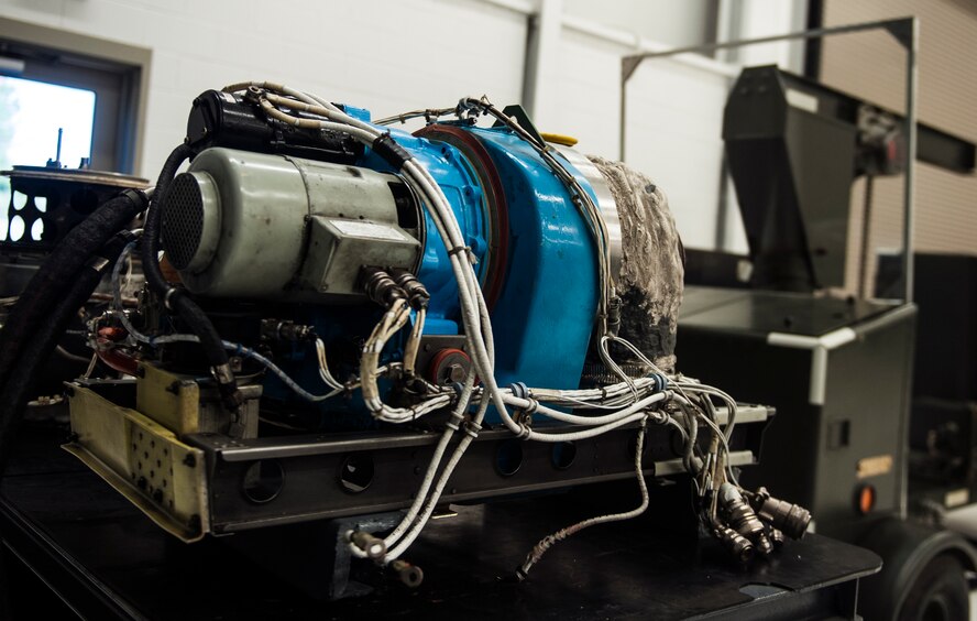 A GTCP-3650 auxiliary power unit (APU) rests on a workstation Dec. 15, 2014, at Moody Air Force Base, Ga. The 23d Component Maintenance Squadron engine propulsion flight established a small gas section to act as the main repair facility for APUs. (U.S. Air Force photo by Senior Airman Olivia Bumpers/Released)