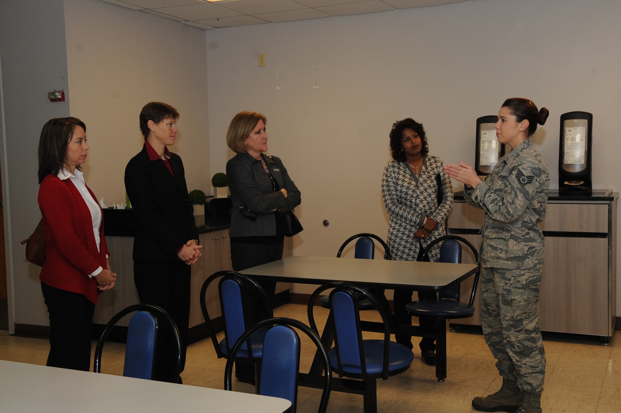 Staff Sgt. Kelsi Ferinella, NCO in-charge of The Lift kiosk operation, briefs Air Force Global Strike Command spouses on The Lift and The Source, flightline operational kitchen and touch-and-go dining on Barksdale Air Force Base, La. Dec. 16, 2014. Ferinella briefed on the types of food served along with the quality of food, upgrades and changes and customer service hours for flightline workers. (U.S. Air Force photo/Senior Airman Kristin High)