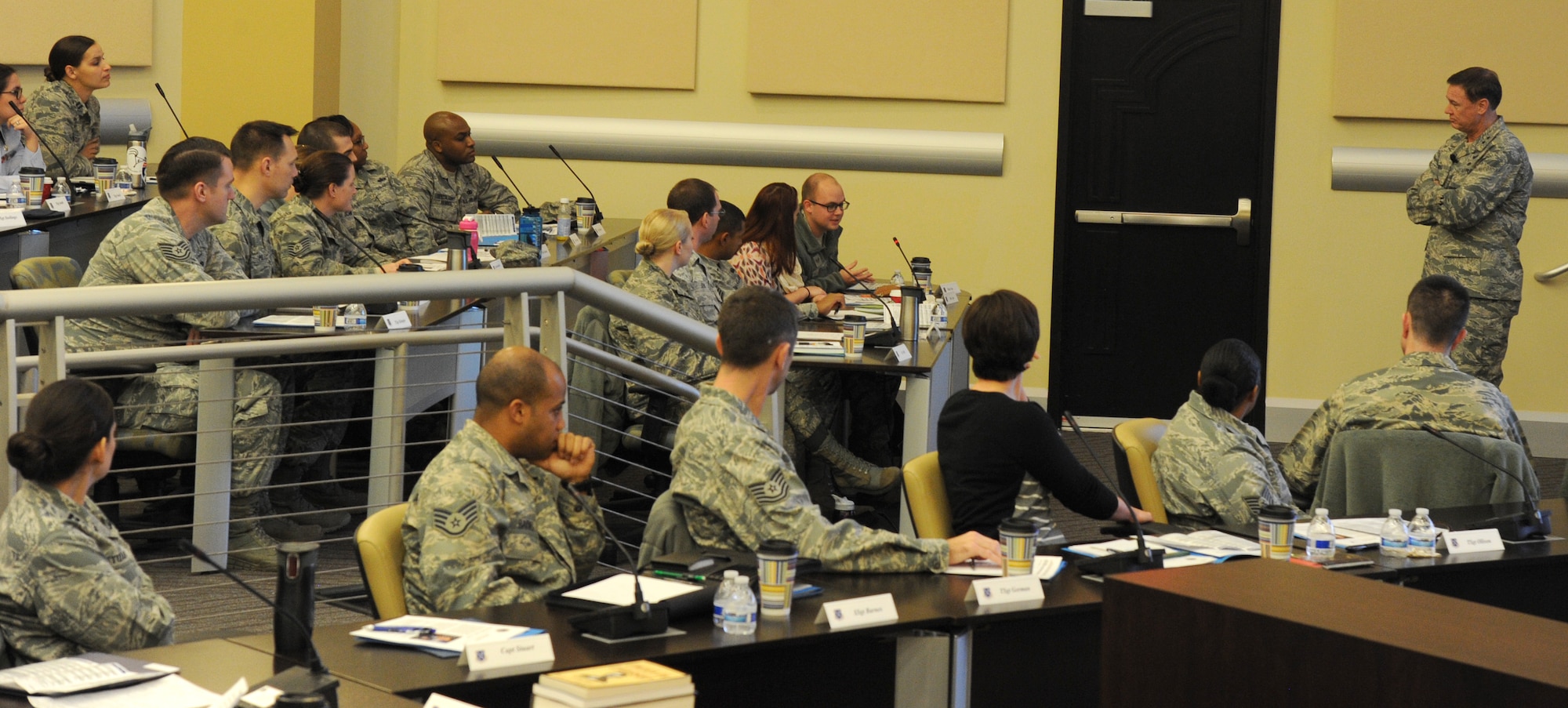 Air Force District of Washington Commander Maj. Gen. Darryl Burke listens as an Airman shares a key trait he values in leaders during the annual AFDW Capital Airman Seminar at Joint Base Andrews, Md., Dec. 16, 2014. The four-day seminar features mentorship sessions hosted by senior-level Air Force leaders including the Under Secretary of the Air Force the Honorable Eric Fanning and Vice Chief of Staff Gen. Larry Spencer. (U.S. Air Force photo/Master Sgt. Tammie Moore)