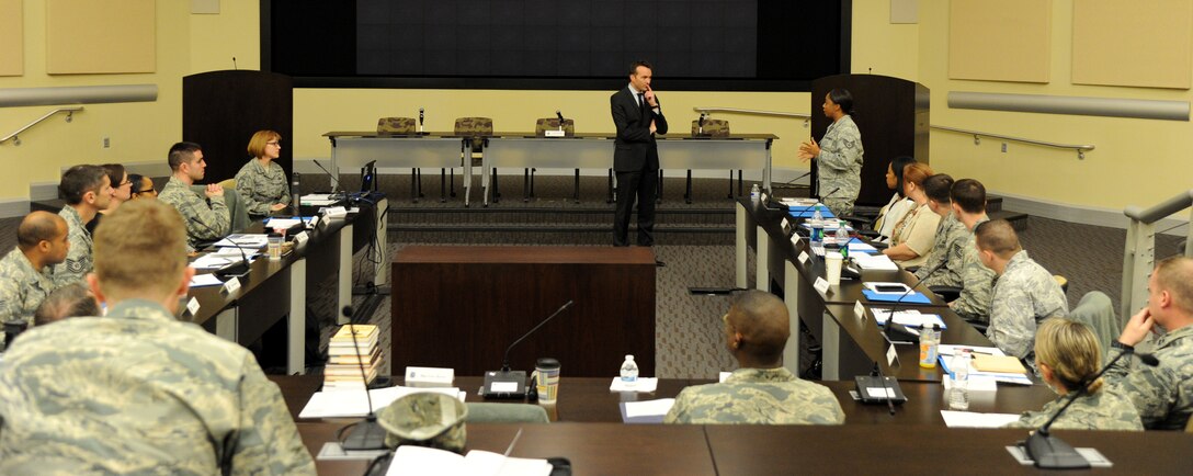 The Honorable Eric Fanning, Under Secretary of the Air Force, listens as Staff Sgt. Karin Nelson asks a questions about reserve duty during the annual Air Force District of Washington Capital Airman Seminar at Joint Base Andrews, Md., Dec. 16, 2014. Fifty-one enlisted, officer, and civilian Airmen were selected from across the National Capital Region to attend the four-day professional development seminar. Nelson, a Reservist assigned to the 459th Air Refueling Wing as an aerospace medical technical, is on active-duty orders at the AFDW. (U.S. Air Force photo/Master Sgt. Tammie Moore)