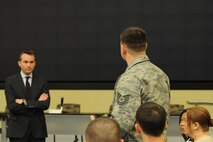 The Honorable Eric Fanning, Under Secretary of the Air Force, listens to a question from Tech. Sgt. Adam Clonick during the annual Air Force District of Washington Capital Airman Seminar at Joint Base Andrews, Md., Dec. 16, 2014. Fifty-one enlisted, officer, and civilian Airmen were selected from across the National Capital Region to attend the four-day professional development seminar. Clonick is an AFDW contracting officer. (U.S. Air Force photo/Master Sgt. Tammie Moore)