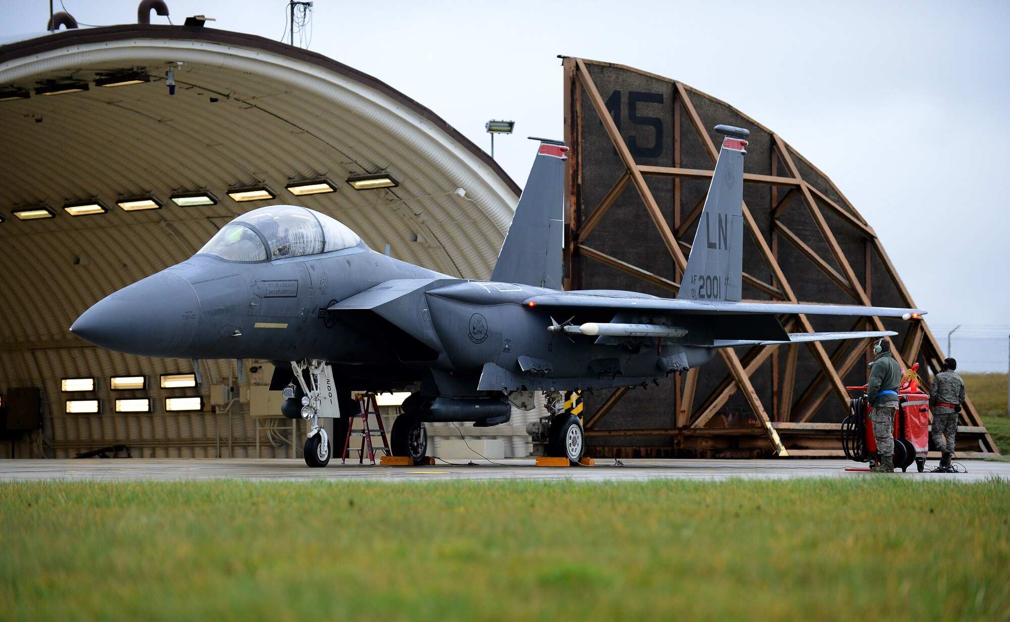 Spangdahlem Airmen look over an F-15E Strike Eagle assigned to the 494th Fighter Squadron at Royal Air Force Lakenheath, England, before the pilot participates in exercise Iron Hand 15-2 at Spangdahlem Air Base, Germany, Dec. 18, 2014. Iron Hand 15-2 brought together all of United States Air Forces in Europe-Air Force Africa’s fighter airframes to train. (U.S. Air Force photo by Airman 1st Class Luke Kitterman/Released)