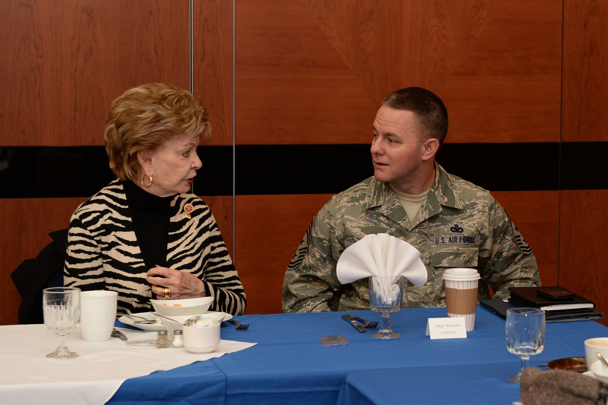 U.S. Rep. Madeleine Bordallo, representative of at Large district of Guam, talks with U.S. Air Force Chief Master Sgt. Brian Gates, 52nd Fighter Wing command chief, during an immersion visit Dec. 17, 2014, at Spangdahlem Air Base, Germany. The delegation received a mission brief, toured facilities and ate lunch with Airmen, including constituents from their own districts. (U.S. Air Force photo by Airman 1st Class Dylan Nuckolls/Released)