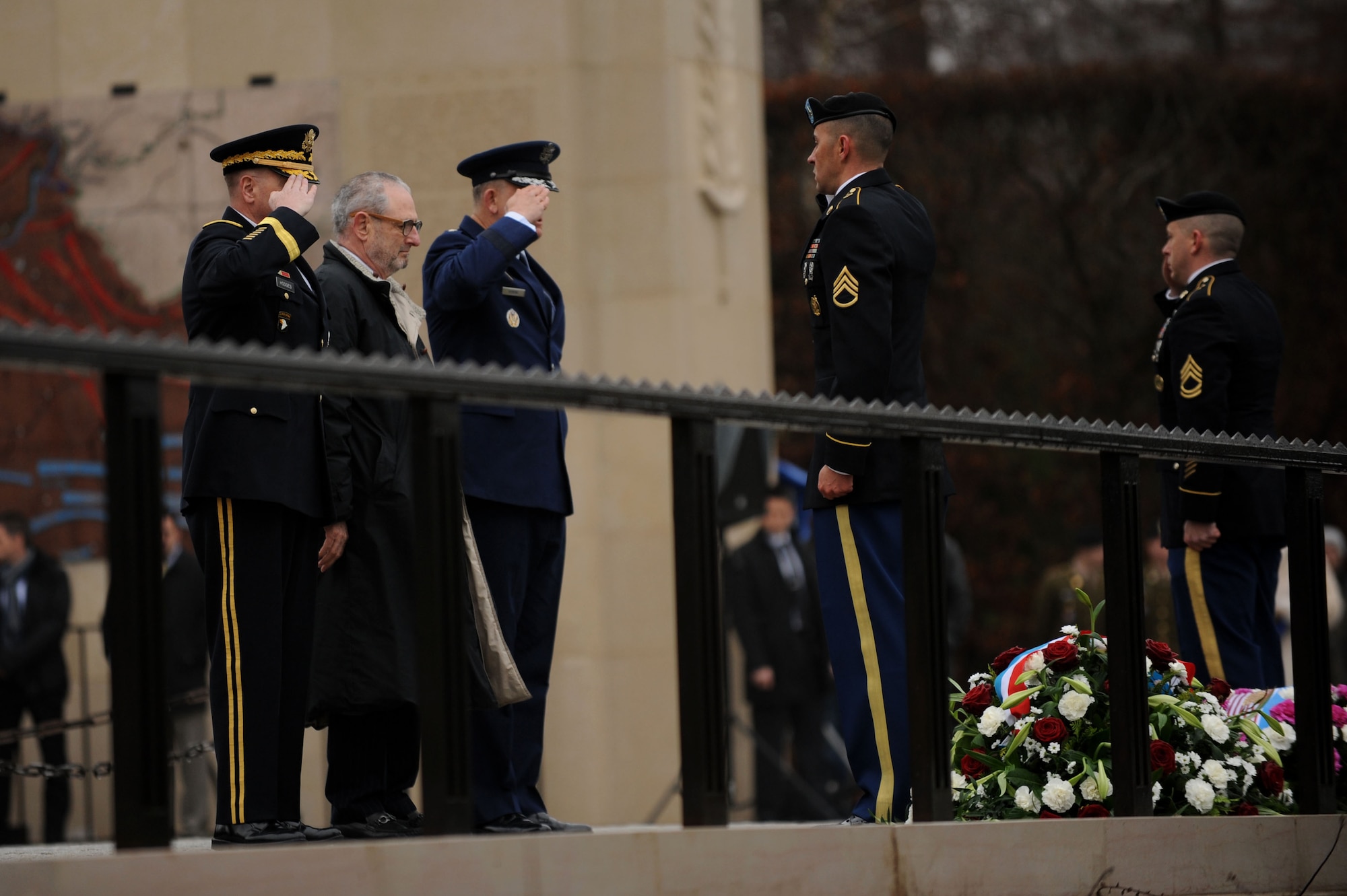 U.S. Army Lt. Gen. Ben Hodges, U.S. Army Europe commander, left; Robert Mandell, U.S. Ambassador to Luxembourg, center; and U.S. Air Force Gen. Frank Gorenc, U. S. Air Forces in Europe and Air Forces Africa commander, right, salute a wreath during the 70th Anniversary of the Battle of the Bulge at the Luxembourg American Military Cemetery in Luxembourg, Dec. 16, 2014. The government of Luxembourg and the U.S. Embassy held the memorial in honor of the veterans and fallen service members of the Battle of the Bulge. (U.S. Air Force photo by Airman 1st Class Timothy Kim/Released)