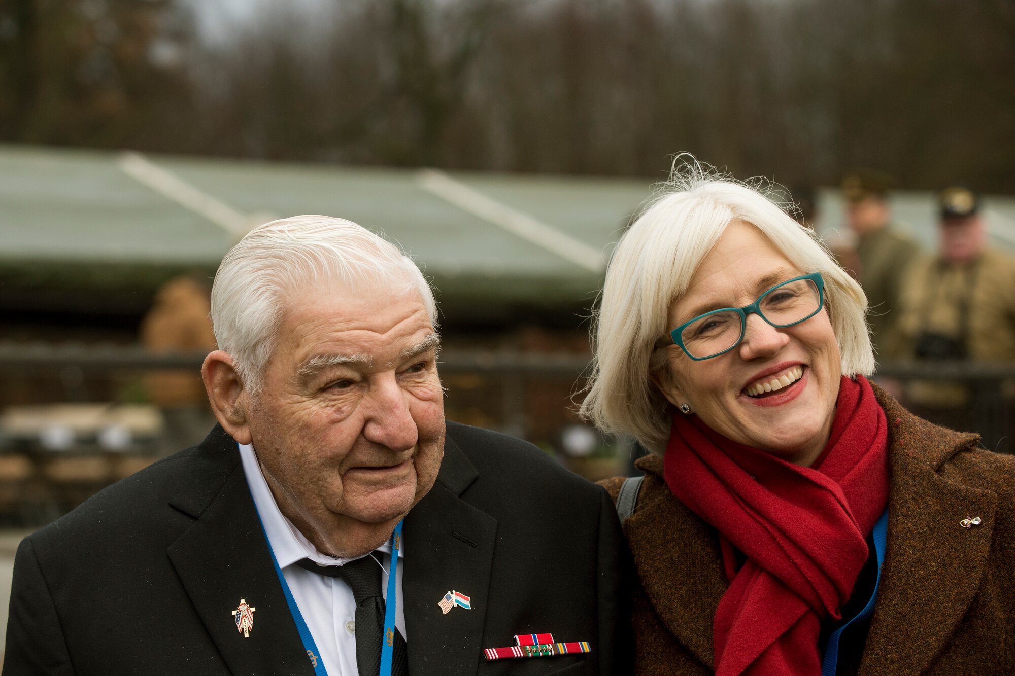 George Merz, a World War II veteran, and Helen Patton, granddaughter of U.S. Army Gen. George Patton, pose for a picture after a ceremony at Luxembourg American Cemetery  and Memorial Dec. 16, 2014, in Luxembourg. Merz and other World War II veterans and their families attended the ceremony as well as Battle of the Bulge-related sites throughout Belgium and Luxembourg. (U.S. Air Force photo by Senior Airman Rusty Frank/Released)