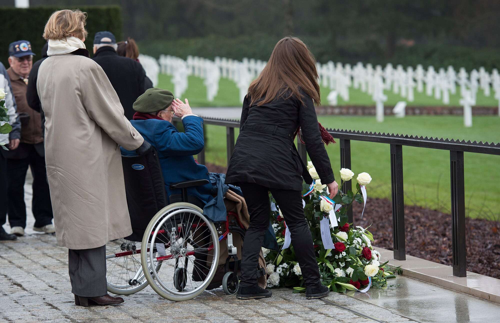 A World War II veteran salutes a memorial wreath during the Battle of the Bulge 70th Anniversary ceremony at the Luxembourg American Cemetery and Memorial in Luxembourg, Dec. 16, 2014. The U.S. Embassy and government of Luxembourg hosted the ceremony to commemorate those who gave their lives during the battle, as well as the surviving veterans of World War II. (U.S. Air Force photo by Staff Sgt. Chad Warren/Released)