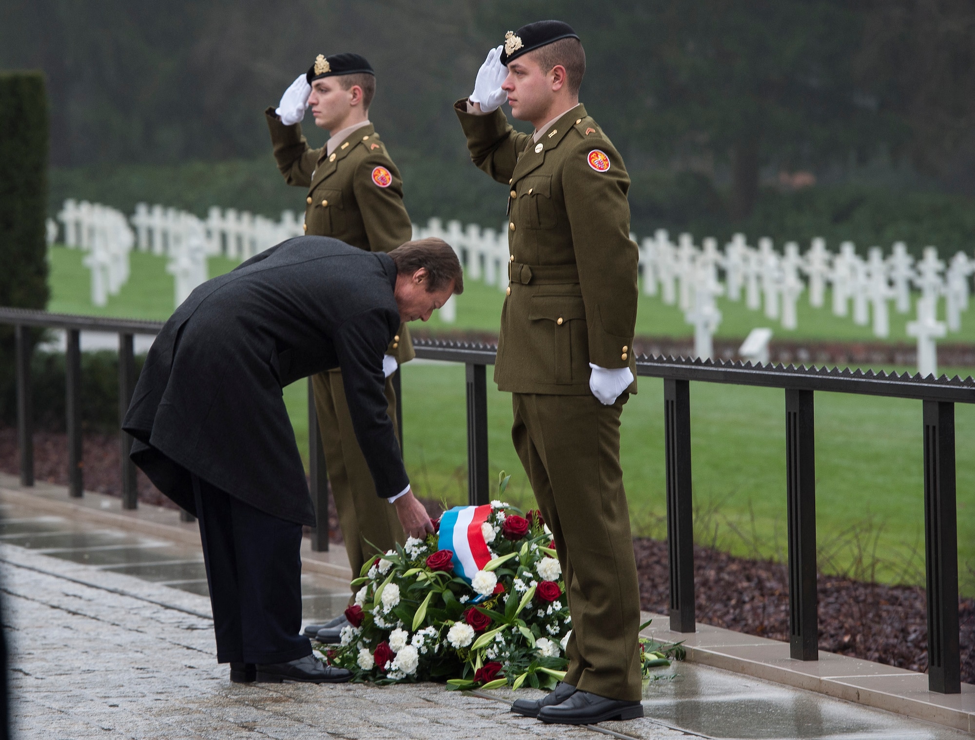 Grand Duke Henri of Luxembourg places a flower on a memorial wreath during the Battle of the Bulge 70th Anniversary ceremony at the Luxembourg American Cemetery and Memorial in Luxembourg, Dec. 16, 2014. The cemetery holds 5,076 fallen American service members, many of whom lost their lives during the Battle of the Bulge. (U.S. Air Force photo by Staff Sgt. Chad Warren/Released)