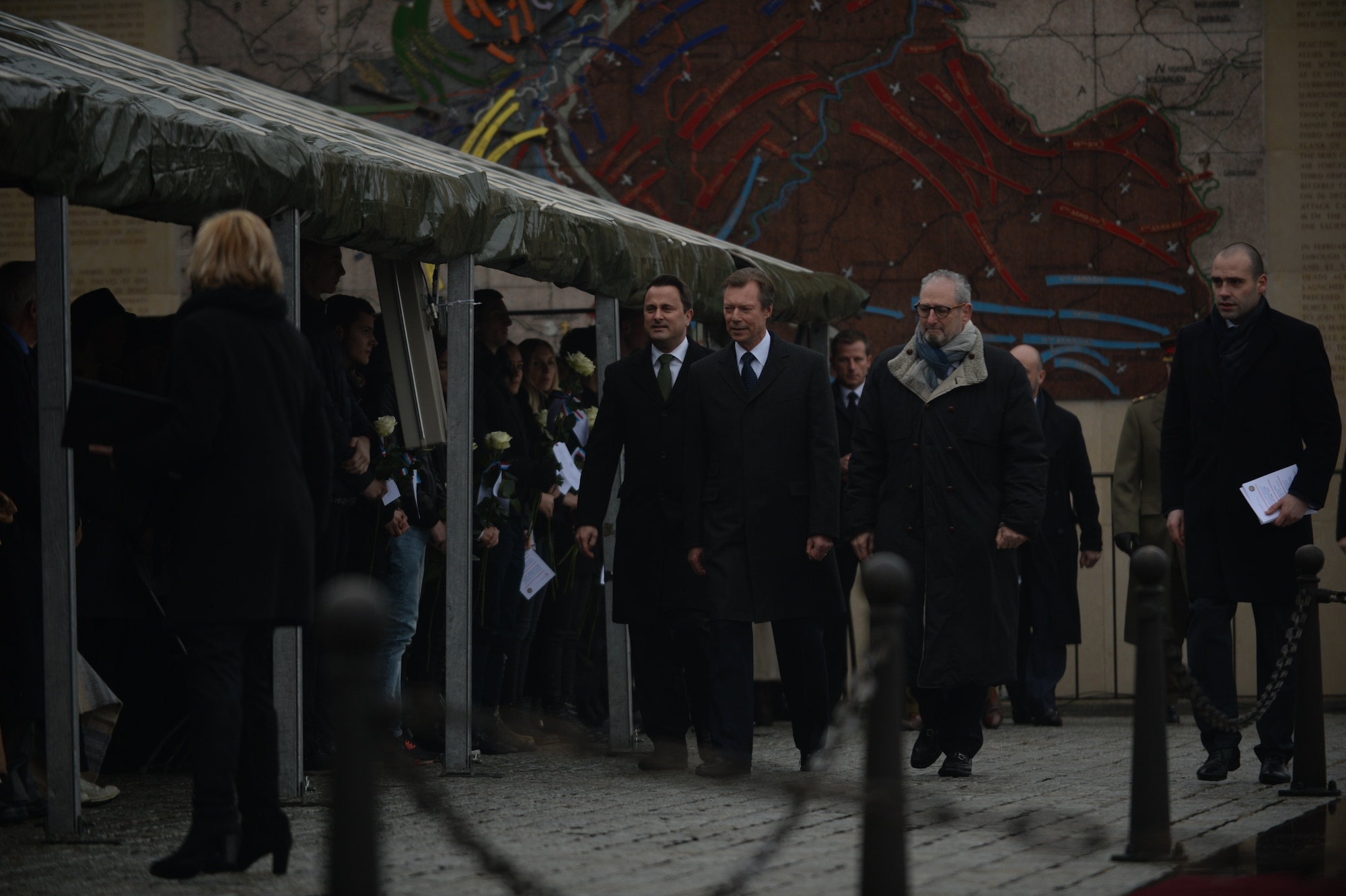 Grand Duke Henri of Luxembourg, center; Xavier Bettel, prime minister of Luxembourg, center left; and Robert Mandell, U.S. ambassador to Luxembourg, center right, walk to their seats before a commemorative ceremony at Luxembourg American Cemetery and Memorial in Luxembourg, Dec. 16, 2014. The ceremony observed the 70th anniversary of the Battle of the Bulge, a six-week campaign in the Ardennes region Dec. 16, 1944 through Jan. 25, 1945. (U.S. Air Force photo by Staff Sgt. Joe W. McFadden/Released) 