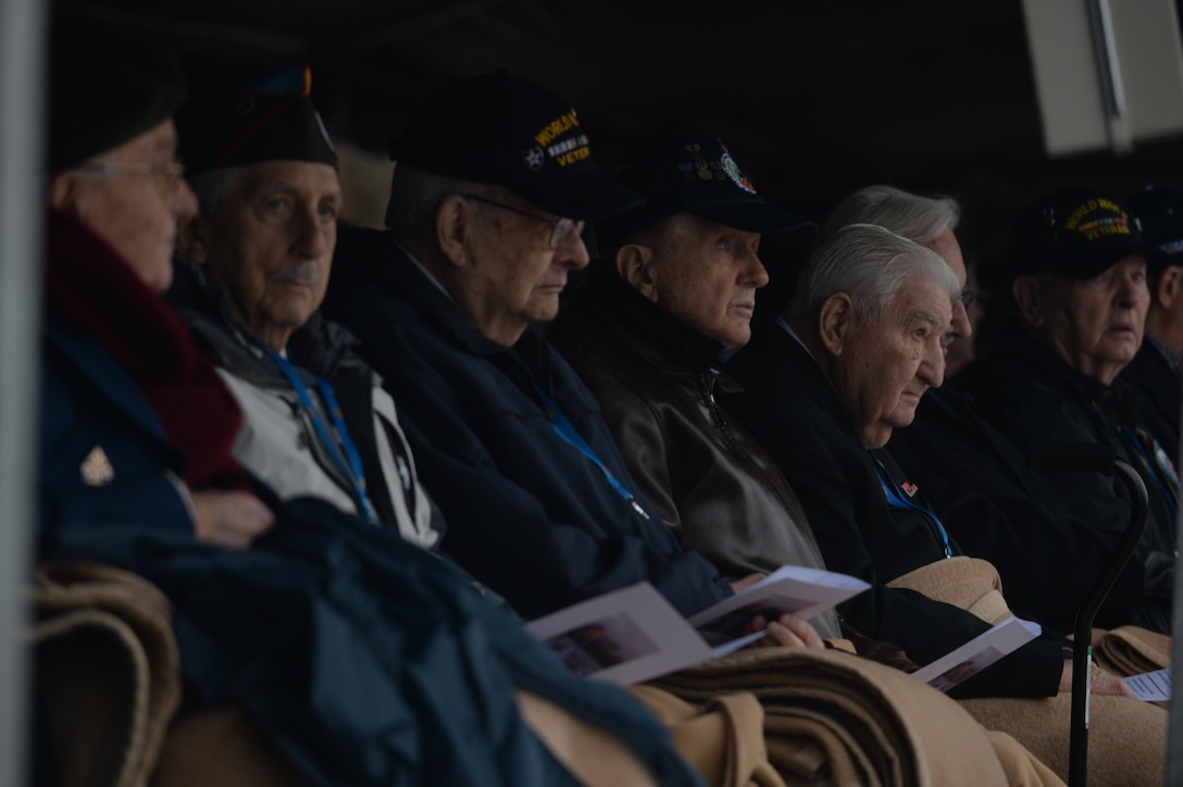 A row of World War II veterans wait before a commemorative ceremony at Luxembourg American Cemetery and Memorial in Luxembourg, Dec. 16, 2014. The veterans toured sites throughout Belgium and Luxembourg related to the Battle of the Bulge. (U.S. Air Force photo by Staff Sgt. Joe W. McFadden/Released) 