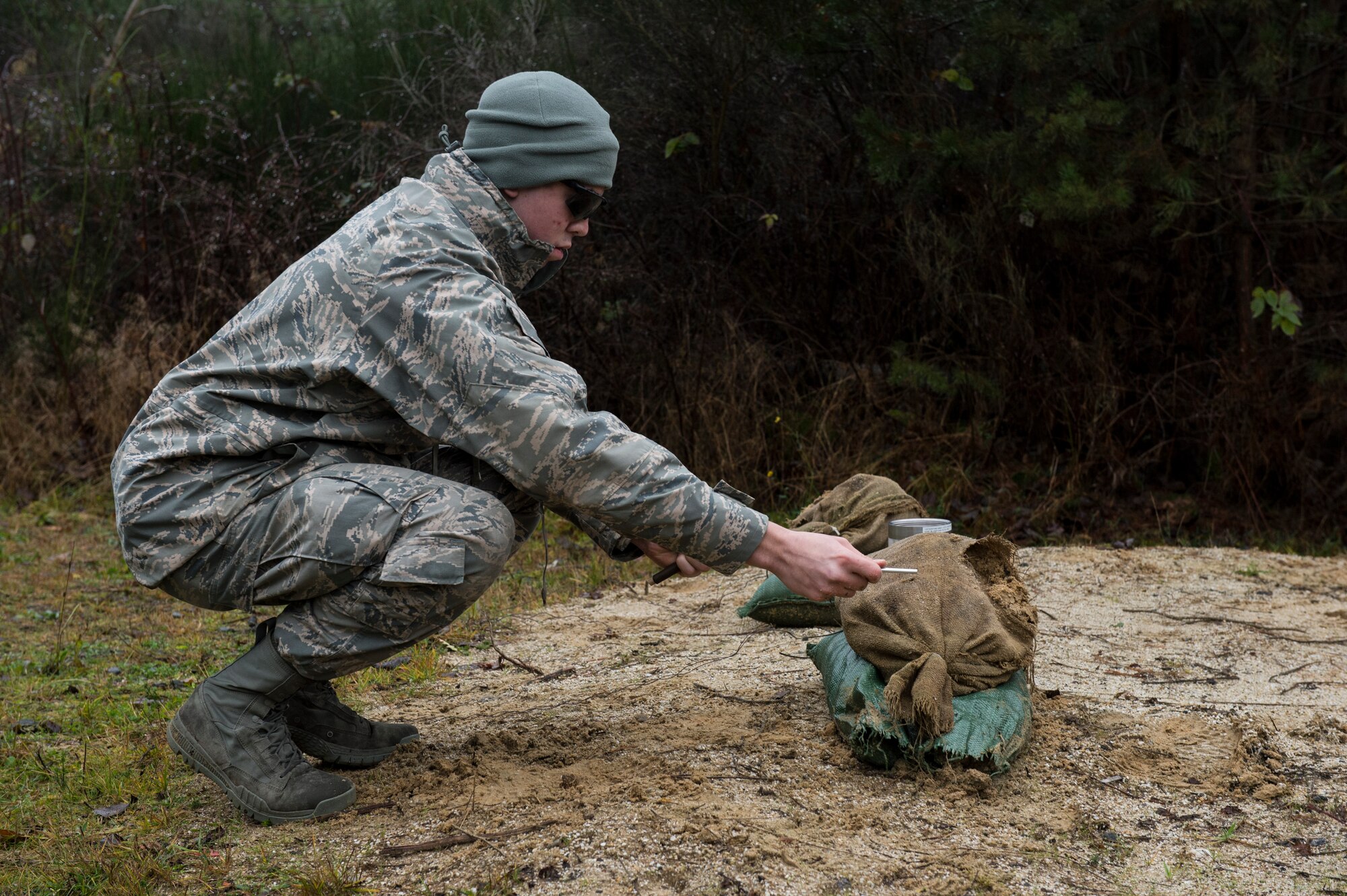 A member of the 52nd Civil Engineer Squadron Explosive Ordnance Disposal flight prepares a blasting cap during a demolition training session on Spangdahlem Air Base, Germany, Dec. 17, 2014. The blasting cap detonates the explosives used during the training. (U.S. Air Force photo by Staff Sgt. Christopher Ruano/Released)