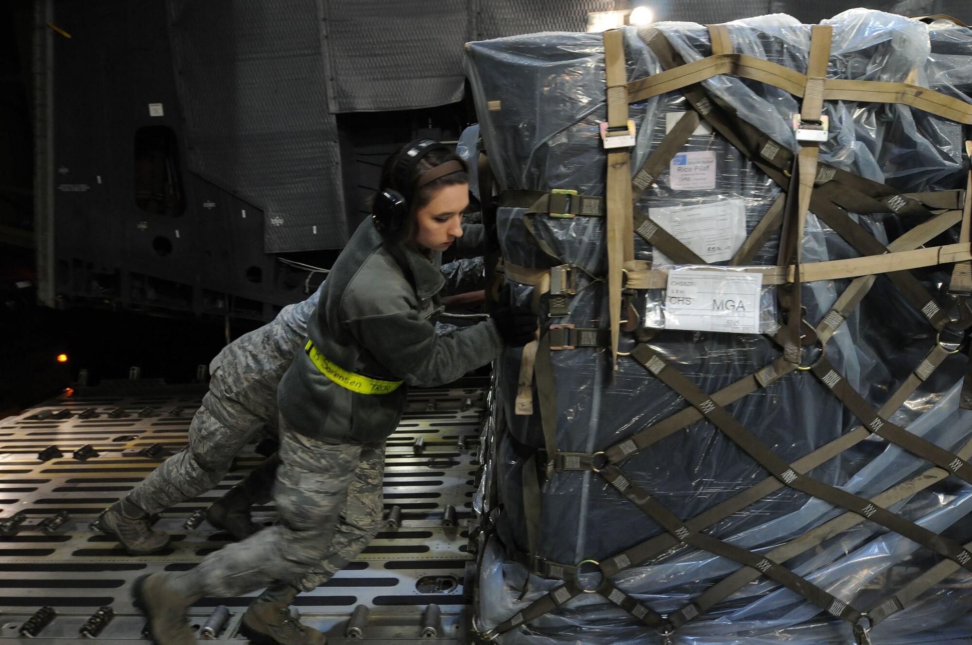 Airmen from the 437th Aerial Port Squadron here at Charleston AFB assisting loadmasters from the 709th Airlift Squadron with loading the humanitarian supplies on the C-5M Supergalaxy, before the 709th AS aircrew members fly down to Nicaragua. The supplies, consisting of food staples and educational materials, will be delivered to less fortunate people in the underserved ares around Nicaragua. (U.S. Air Force photo/2nd Lt. Steve Lewis)