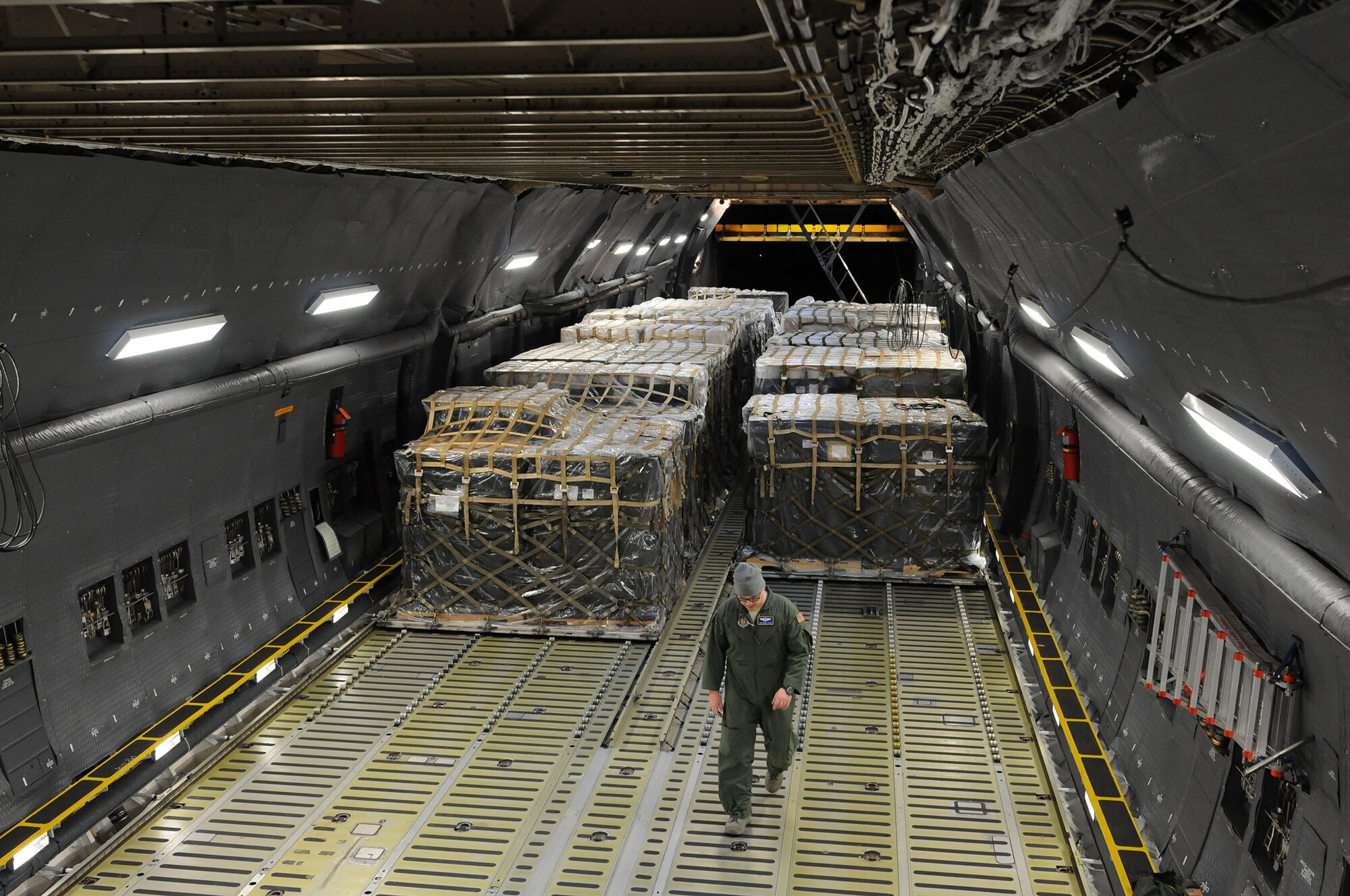 Tech. Sgt. Brian Muse, a 709th Airlift Squadron loadmaster, conducts a cargo inspection after humanitarian supplies were loaded onto a C-5M Super Galaxy at Charleston Air Force Base, South Carolina. The airmen are reservists from the 512th Airlift Squadron located at Dover AFB, Delaware, and are transporting the humanitarian aid to Niceragua. (U.S. Air Force photo by Lt. Steve Lewis)