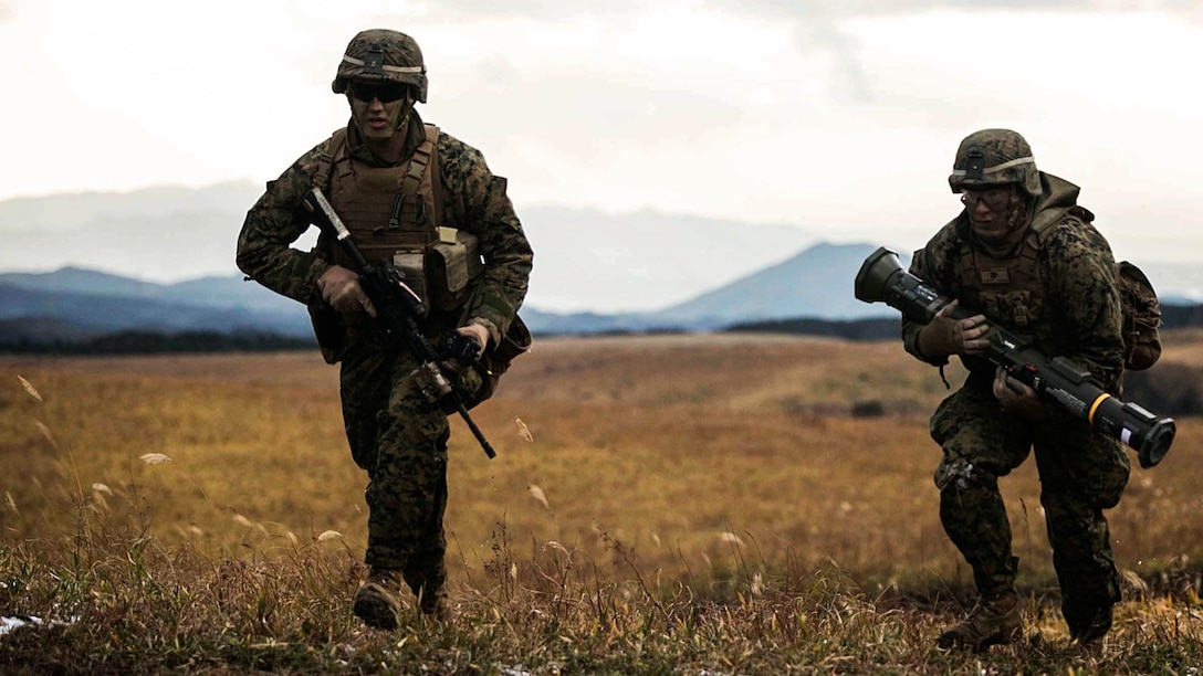 Lance Cpls. Cory P. Daugherty, right, and Samuel S. Jacobson execute live-fire rocket battle drills, Dec. 6, during Forest Light 15-1 at the Oyanohara Training Area in Yamato, Kumamoto prefecture, Japan. Forest Light is a routine, semi-annual exercise designed to enhance the U.S. and Japan military partnership, solidify regional security agreements and improve individual and unit-level skills. Daugherty, from Denver, Colorado, is a combat engineer with Combat Assault Battalion, 3rd Marine Division, III Marine Expeditionary Force. Jacobson, from Bowie, Maryland, is an infantry assaultman with 2nd Battalion, 9th Marine Regiment, currently assigned to 4th Marine Regiment, 3rd Marine Division, III MEF, under the unit deployment program. 