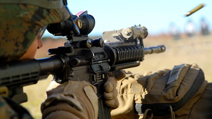 First Lt. Joe A. Bosnick, a platoon commander with Bravo Company, Battalion Landing Team 3rd Battalion, 6th Marine Regiment, 24th Marine Expeditionary Unit, fires an M16-A4 service rifle during a weapons calibration shoot at Camp Lejeune, N.C., Nov. 7, 2014. The Marines conducted the training to ensure all weapon systems are working properly and are ready for the upcoming deployment at the end of the year. (U.S. Marine Corps photo by Lance Cpl. Austin A. Lewis)