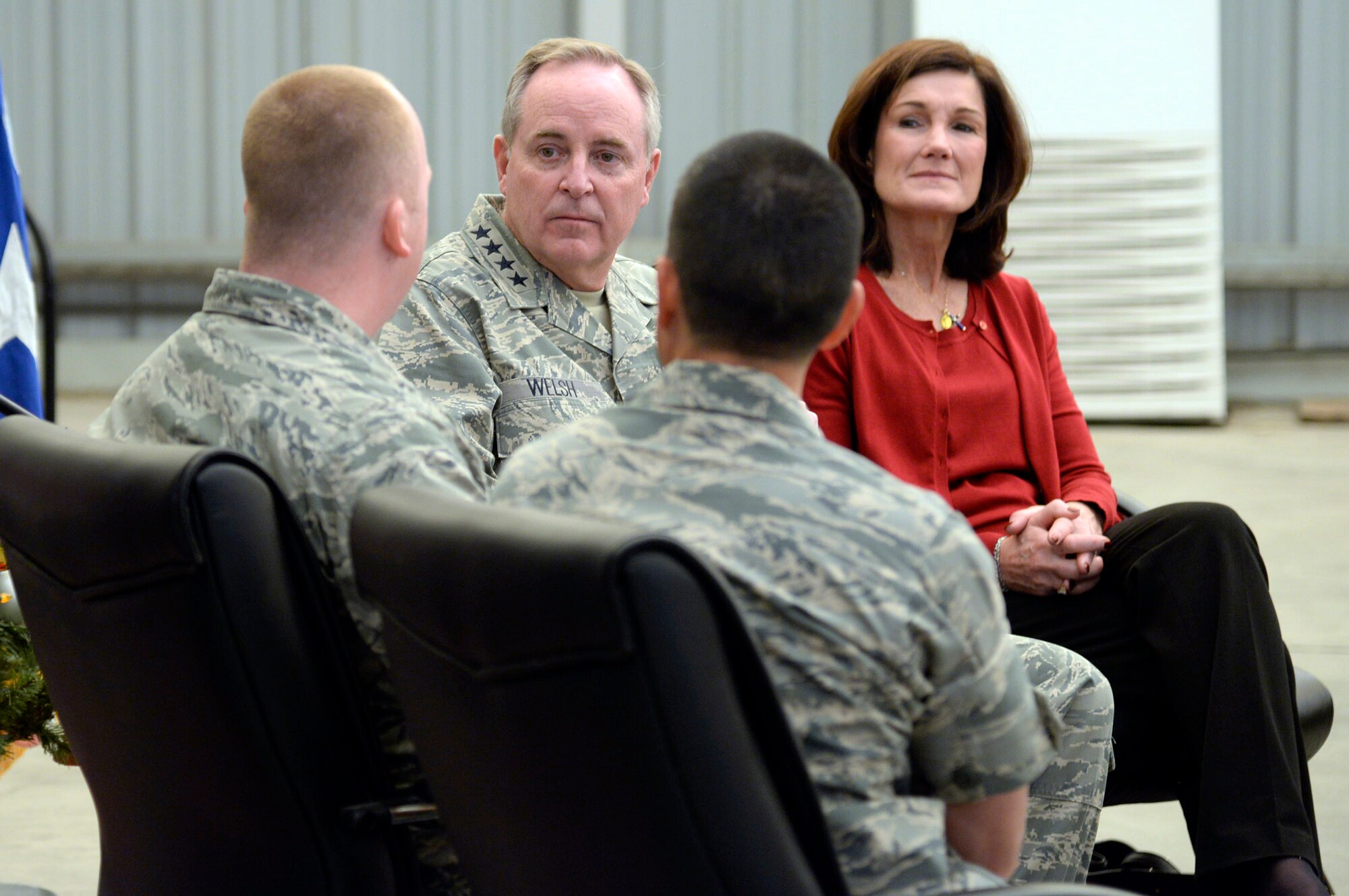 Air Force Chief of Staff Gen. Mark A. Welsh III, and his spouse, Betty, listen as an Airman tells his story during their recent visit to an undisclosed location in Southwest Asia Dec. 16, 2014. Welsh spent a day here to meet with Airmen and thank them for their service. (U.S. Air Force photo/Tech. Sgt. Marie Brown)