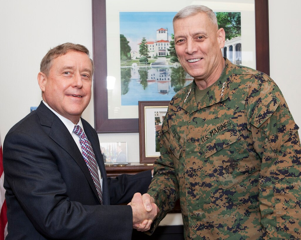 The Assistant Commandant of the Marine Corps, Gen. John M. Paxton, Jr., right, poses for a photo with the President of the Naval Postgraduate School (NPS), Ronald A. Route, at the NPS, Monterey, Ca., Dec. 18, 2014. (U.S. Marine Corps photo by Cpl. Tia Dufour/Released)