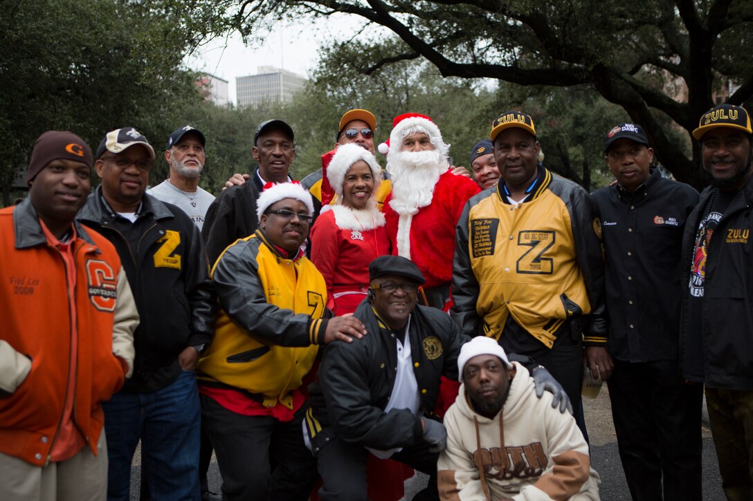 Volunteers and members from the ZULU Social Aid and Pleasure Club posed for a picture during their Toys for Tots distribution event at New Orleans City Hall, Dec. 20, 2014. The members were joined by Lt. Gen. Richard P. Mills, commander of Marine Forces Reserve, and fellow Marines from MFR to pass out toys and bikes to hundreds 
of local children.
