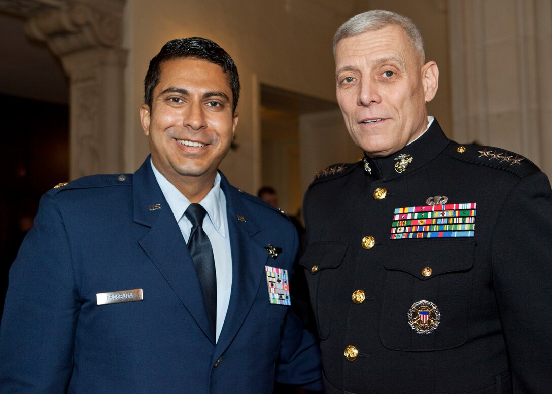 The Assistant Commandant of the Marine Corps, Gen. John M. Paxton, Jr., right, poses for a photo at the Naval Postgraduate School, Monterey, Ca., Dec. 19, 2014. (U.S. Marine Corps photo by Cpl. Tia Dufour/Released)