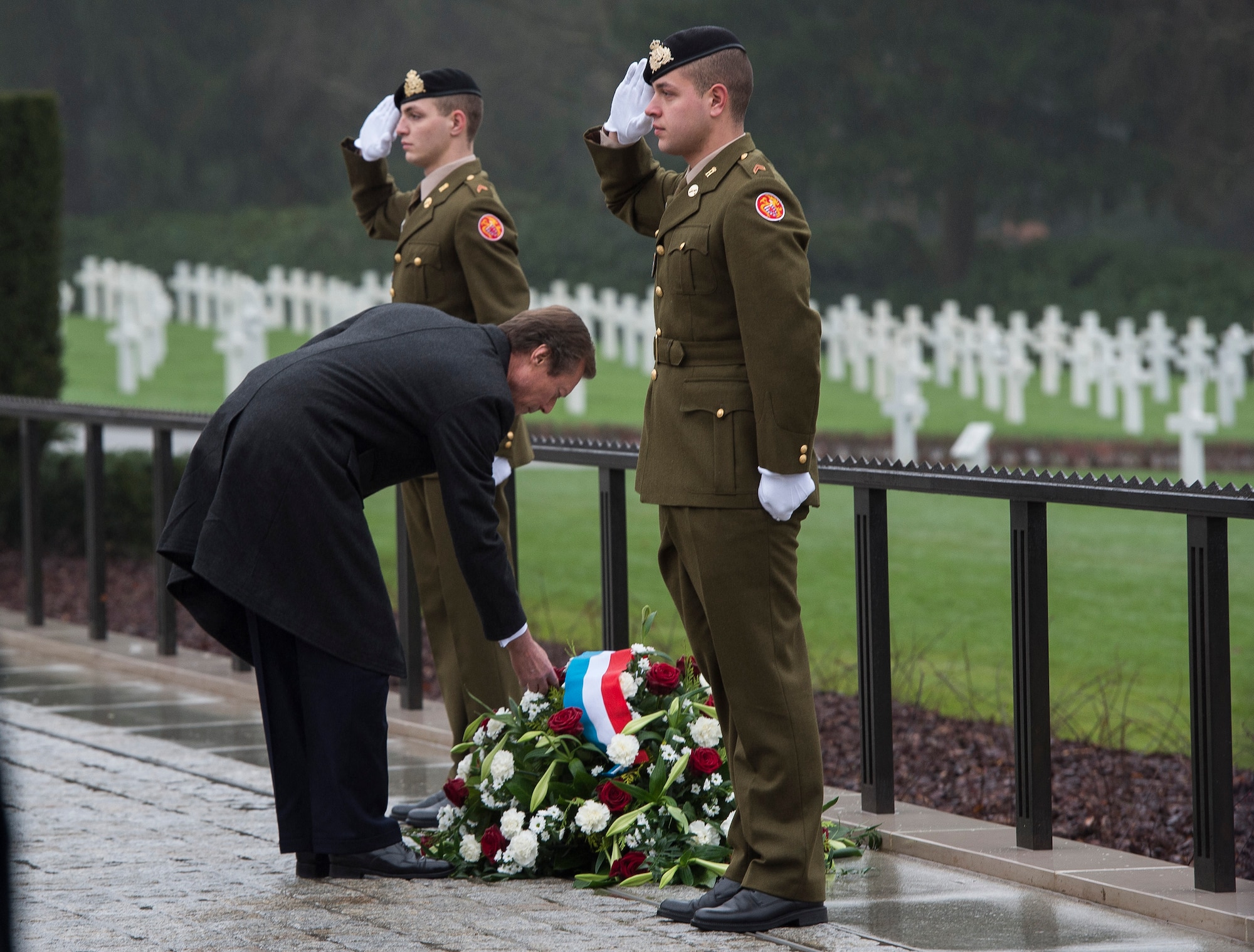 Grand Duke Henri of Luxembourg places a flower on a memorial wreath during the Battle of the Bulge 70th anniversary ceremony at the Luxembourg American Cemetery and Memorial Dec. 16, 2014, in Luxembourg. The cemetery holds 5,076 fallen American service members, many of whom lost their lives during the Battle of the Bulge. (U.S. Air Force photo/Staff Sgt. Chad Warren)