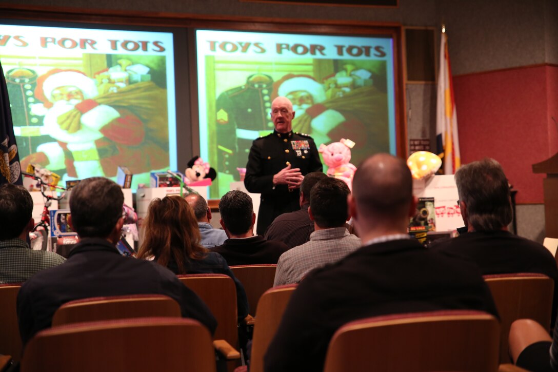 Lt. Gen. Richard P. Mills, commander of Marine Forces Reserve, speaks to workers at Michoud Assembly Facility Dec. 19, 2014, during a presentation of toys donated by the workers to the Marine Corps Reserve Toys for Tots foundation. Mills thanked the guests for their generosity so underprivileged children in the local area can receive a gift during the holiday season. (U.S. Marine Corps photo by Cpl. Brytani Musick)